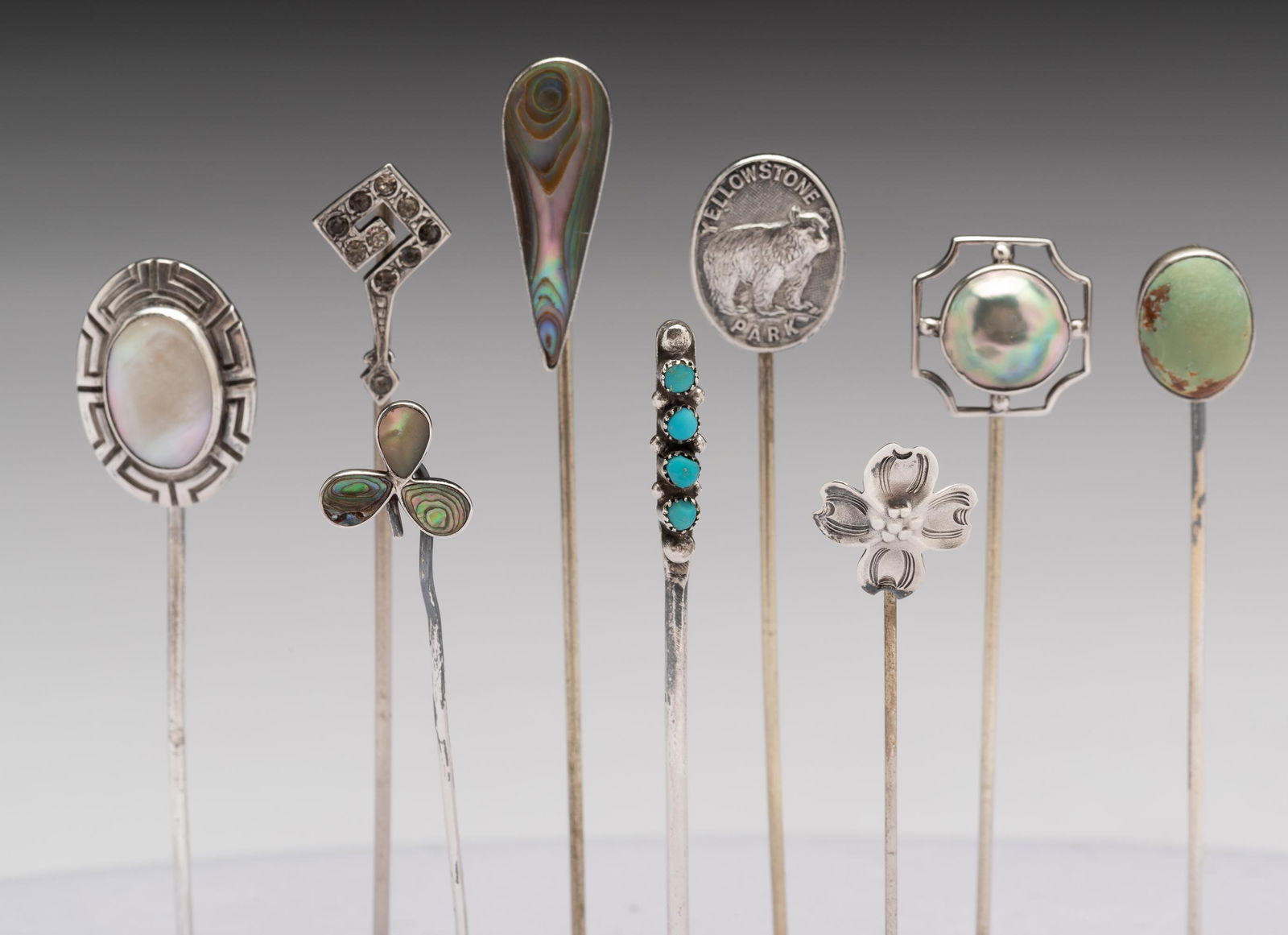 9 Sterling Stick Pins: Abalone pin 1" high. IMPORTANT: Before bidding, please read the terms and conditions. When you registered for the auction you agreed to these terms and will be required to comply with them.