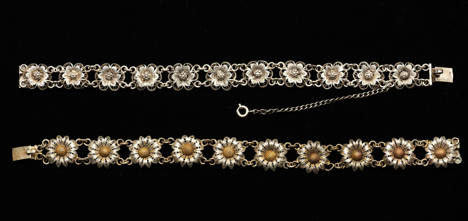 2 Italian Silver Floral Link Bracelets: Each 7-1/2" long. 1 with ring missing between flowers. IMPORTANT: Before bidding, please read the terms and conditions. When you registered for the auction you agreed to these terms and will be requir