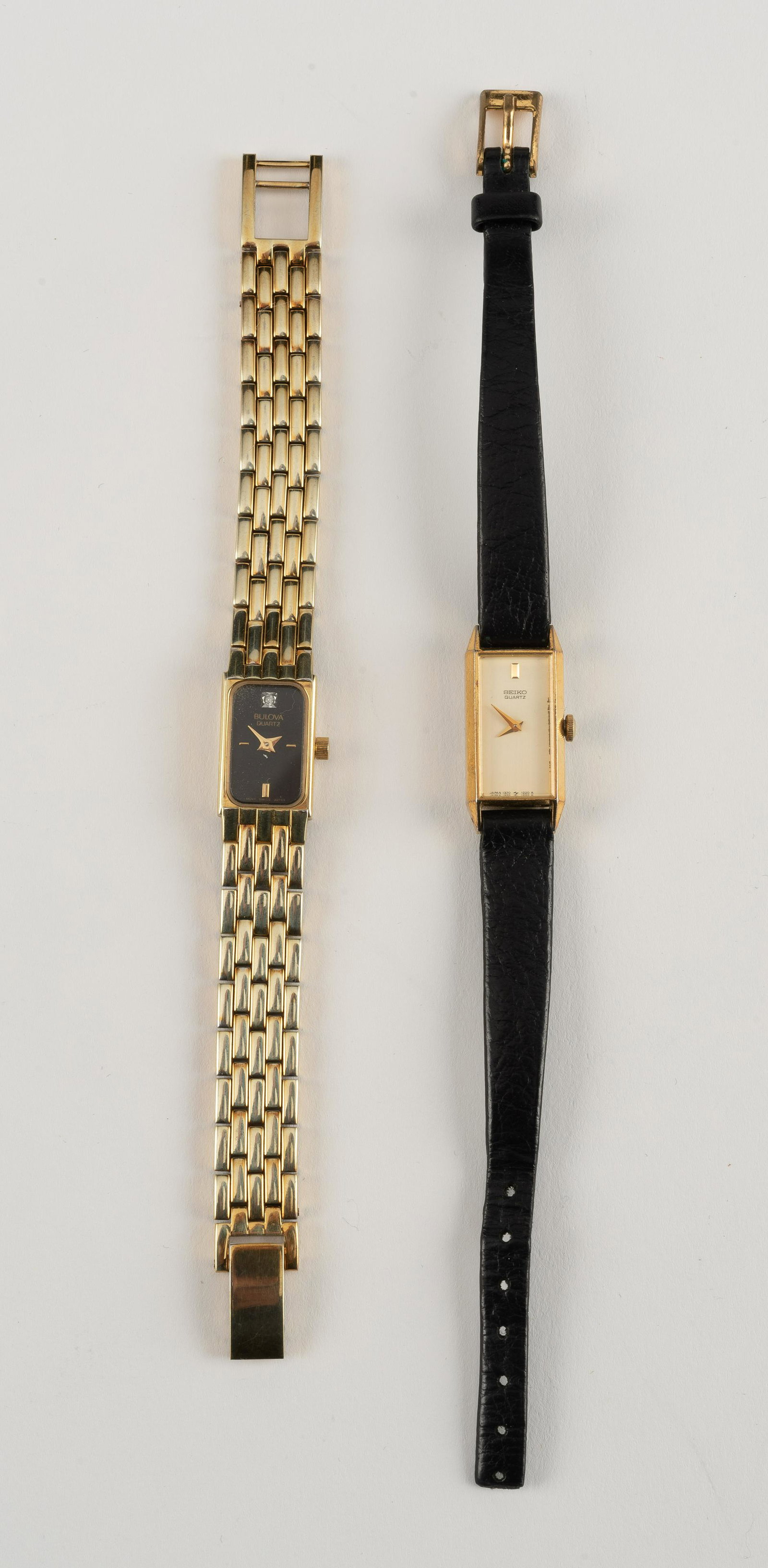 2 Ladies Wristwatches, Bulova & Seiko: Bulova Ladies' P7 on stainless band. Seiko 1220R on black leather band. Each 1" lug to lug; bands 4-1/2" and 5-1/2". Seiko does not run, Bulova untested, needs battery. IMPORTANT: Before bidding, plea