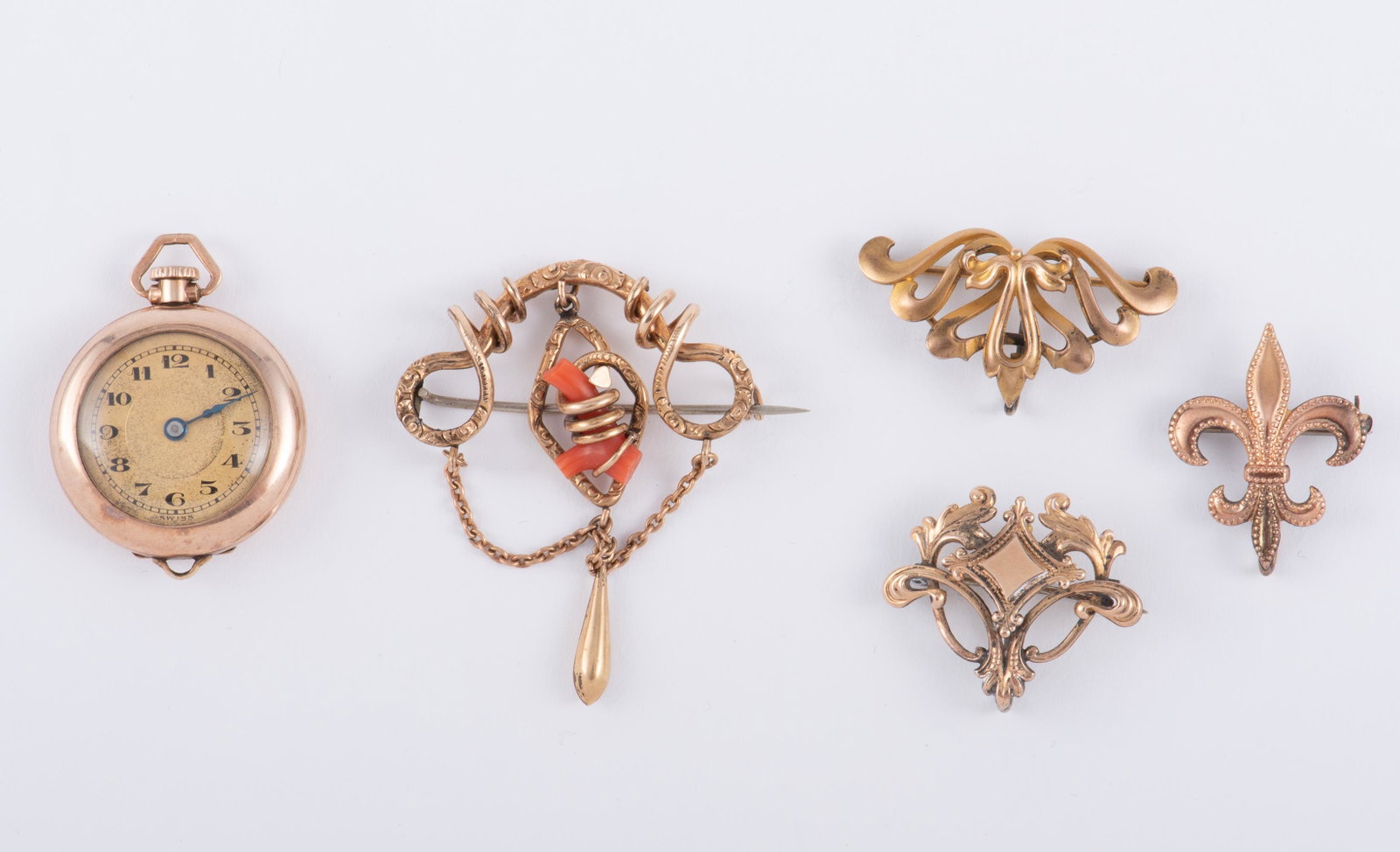 4 GF Antique Watch Pins & 1 Watch: Pendant watch with works marked Swiss 17J, running. Case 1" diameter. Largest watch pin with coral branch 1-1/2" wide. Smallest pin 3/4" wide. IMPORTANT: Before bidding, please read the terms and cond