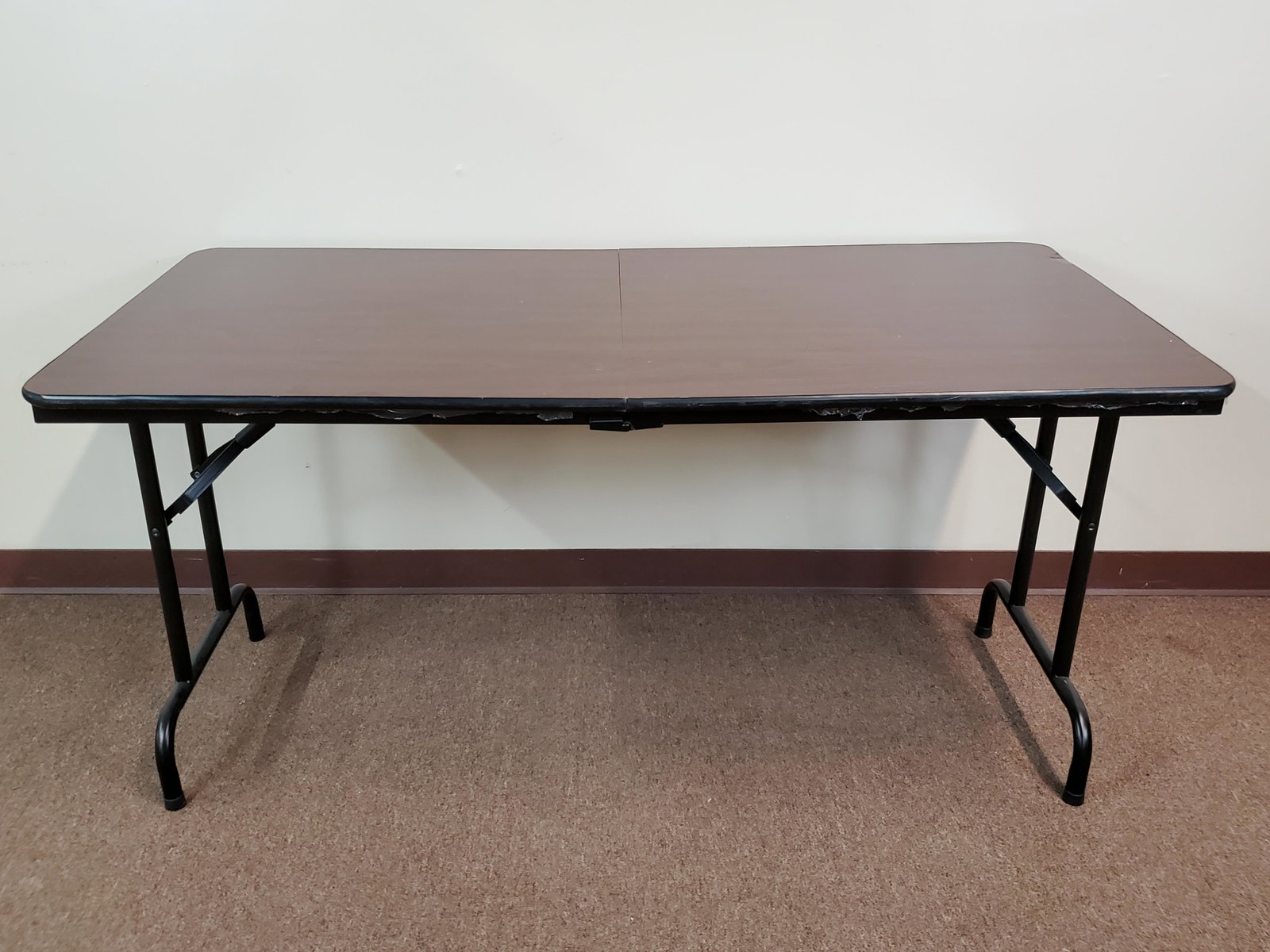 Folding Table: 60" wide X 30" deep X 29" high. Has impression in table top. IMPORTANT: Before bidding, please read the terms and conditions. When you registered for the auction you agreed to these terms and will be 