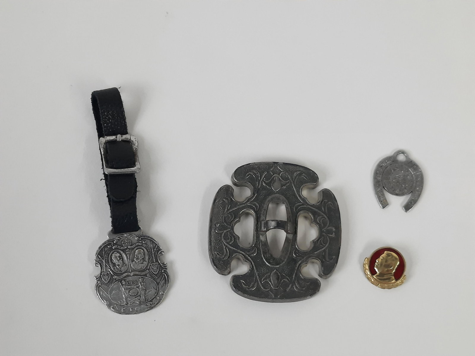 4 Pcs incl NYK Lines Premium and 2 Watch Fobs: Includes North Korean pin with image of Kim II Sung, watch fob depicting a horse shoe with German writing and 2 Reich mark coin, and WWI watch fob with images of Wilhelm and Emperor Franz Josef I date