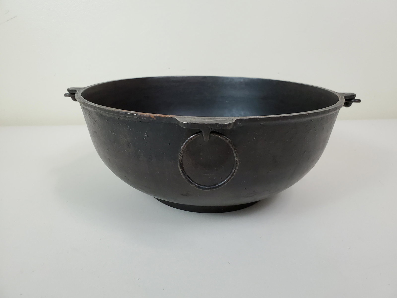 Griswold #3 Scotch Bowl With Trivet: 10 1/4" diameter X 4 1/2" high. Trivet marked 6 8 10. IMPORTANT: Before bidding, please read the terms and conditions. When you registered for the auction you agreed to these terms and will be require