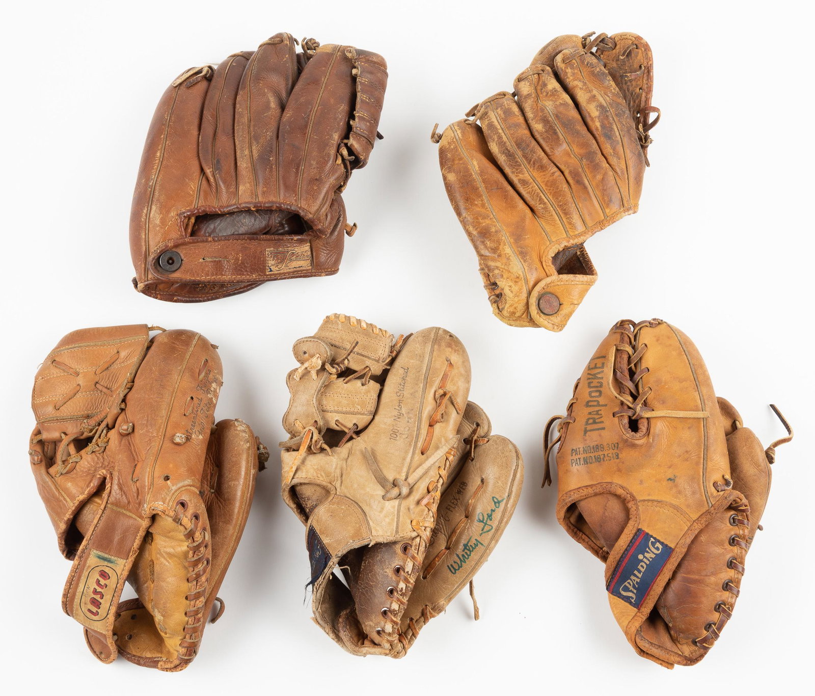 5 Vintage Baseball Gloves Incl. Whitey Ford: Includes Spalding 42-133 Rocky Colavito, 8" long, Rawlings TG72 Stan Musial, 8-1/2" long, signed Whitey Ford Spalding 42-345, 9-1/2" long, TruSports Signed Gus Zernial G20, 8-1/2" long, Lasco 2-520 Pr