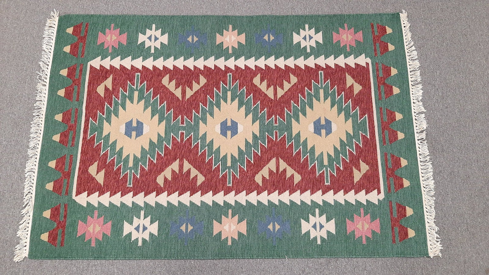 Geometric Area Rug: 3'10" wide X 5'7" long. IMPORTANT: Before bidding, please read the terms and conditions. When you registered for the auction you agreed to these terms and will be required to comply with them.