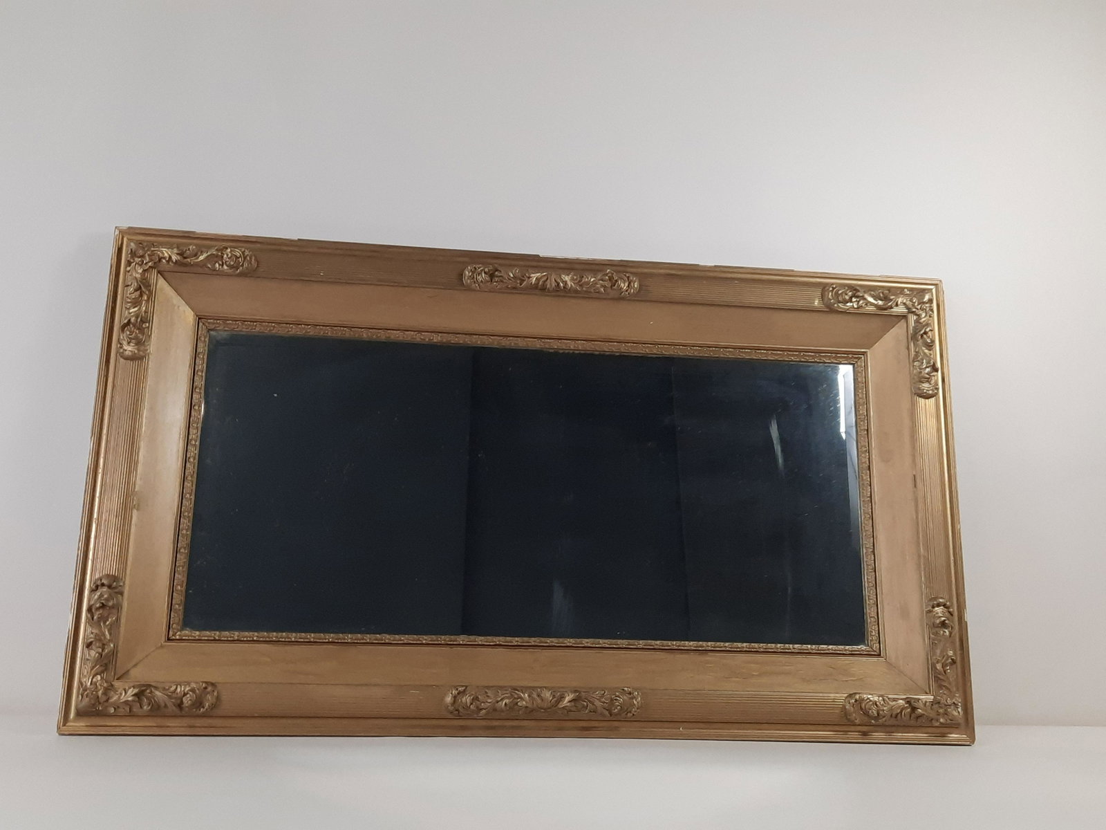 Antique Gilt Mirror: Inspected July 19, 1915. Overall with frame 28-1/4" high x 50" wide. Some losses to frame. Some spotting and streaking to glass. IMPORTANT: Before bidding, please read the terms and conditions. When y