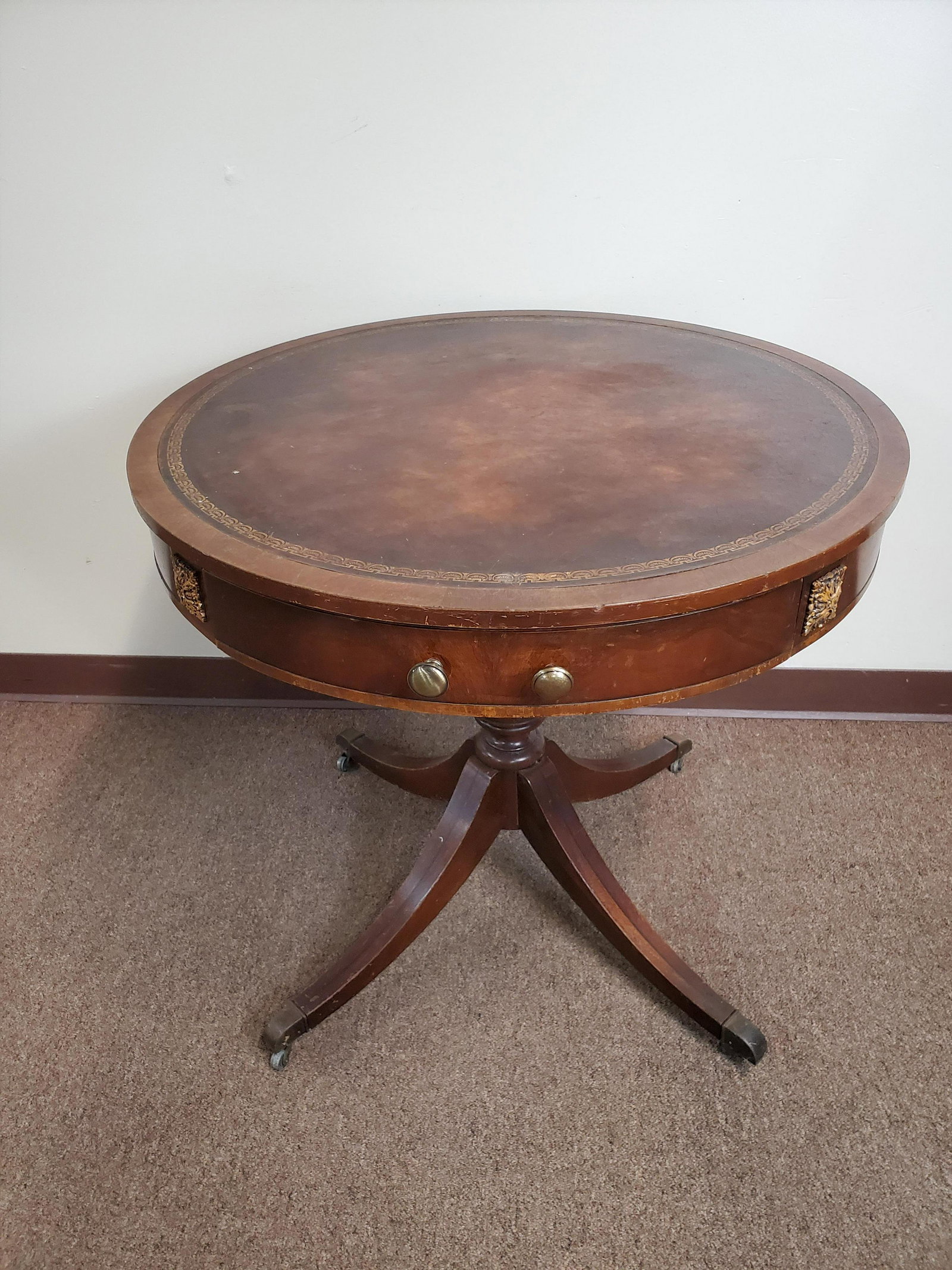 Leather Top Drum Table: 30" diameter X 27 1/2" high. IMPORTANT: Before bidding, please read the terms and conditions. When you registered for the auction you agreed to these terms and will be required to comply with them.