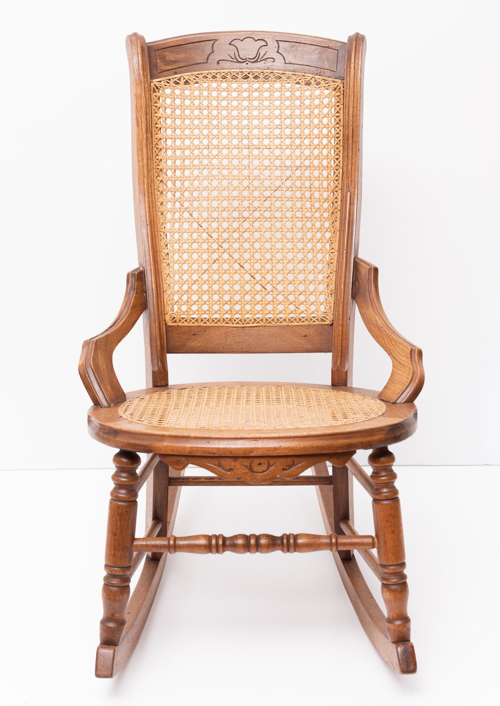 Cane-Back Nursing Rocker: 18-1/2" wide x 17" deep x 35" high. IMPORTANT: Before bidding, please read the terms and conditions. When you registered for the auction you agreed to these terms and will be required to comply with t