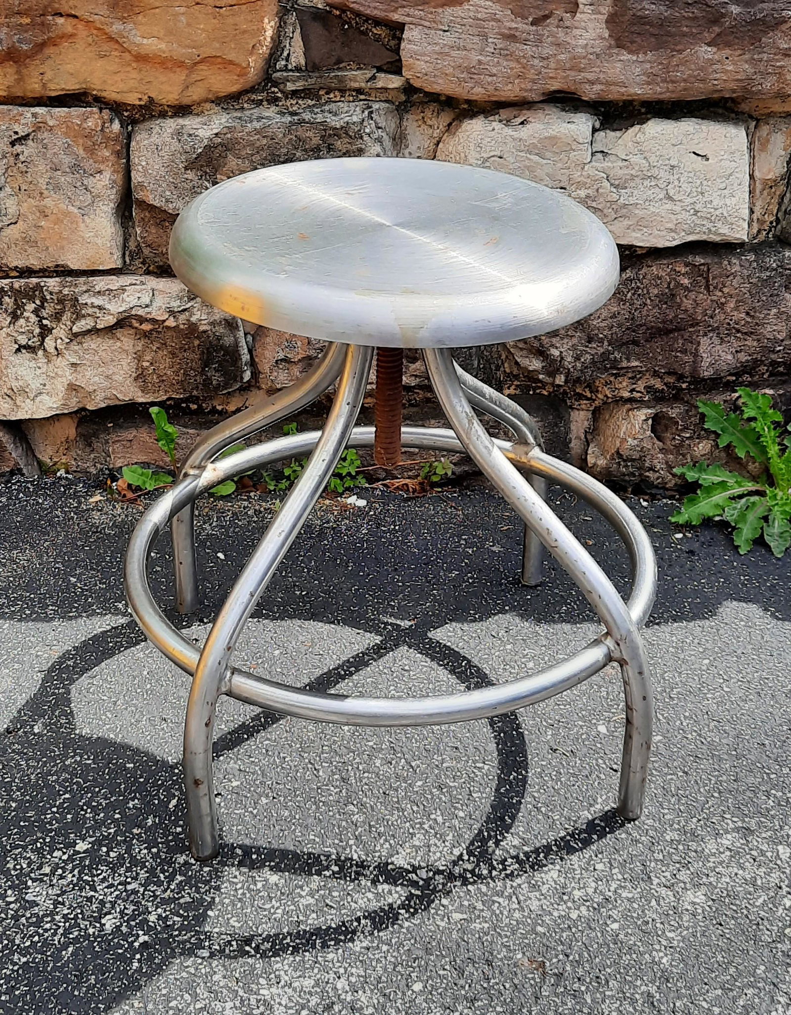 Stainless Steel Medical Stool: 18" diameter at base. Overall 18 3/4" high. Adjustable seat. Some corrosion and staining. No manufacturer mark. IMPORTANT: Before bidding, please read the terms and conditions. When you registered for