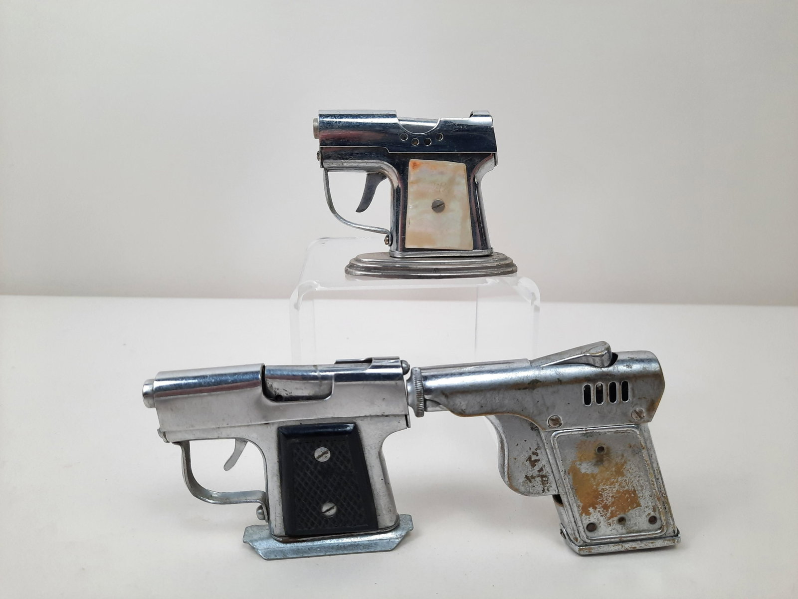 3 Made in Occupied Japan Gun Lighters: 2-1/2" to 3" wide x 2" to 2-1/4" high.