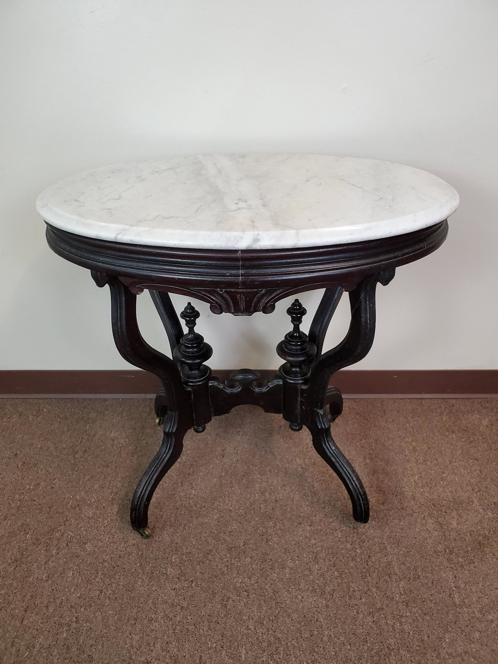 Oval Marble Top Table: 30 1/4" wide X 19 1/2" deep X 29 1/2" high. Has repair to one leg.