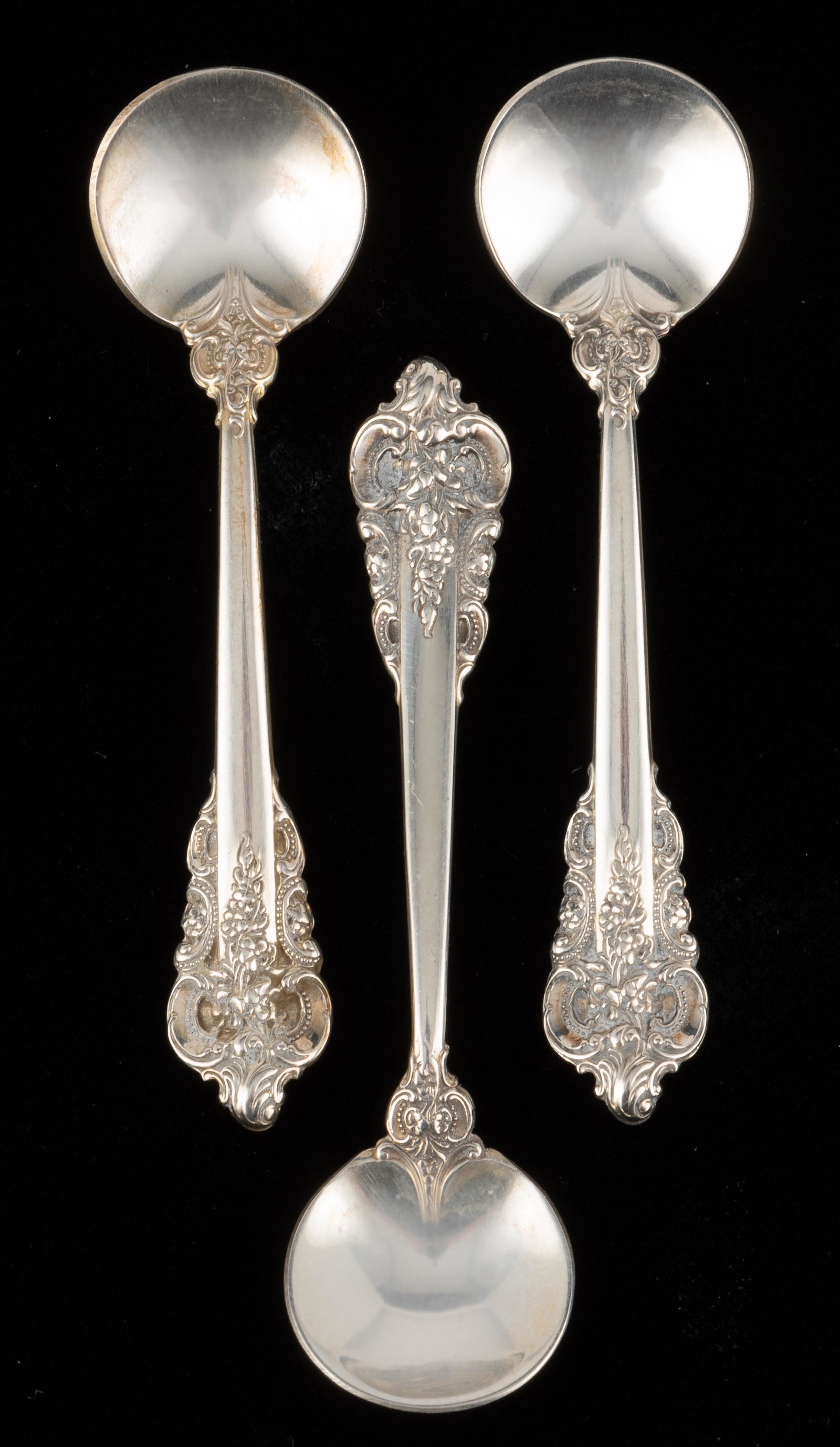 3 Wallace Sterling Salt Spoons: Wallace, mid 20th century. Grand Baroque pattern. 0.4 ozt. total. Each 2 1/2" long. IMPORTANT: Before bidding, please read the terms and conditions. When you registered for the auction you agreed to t
