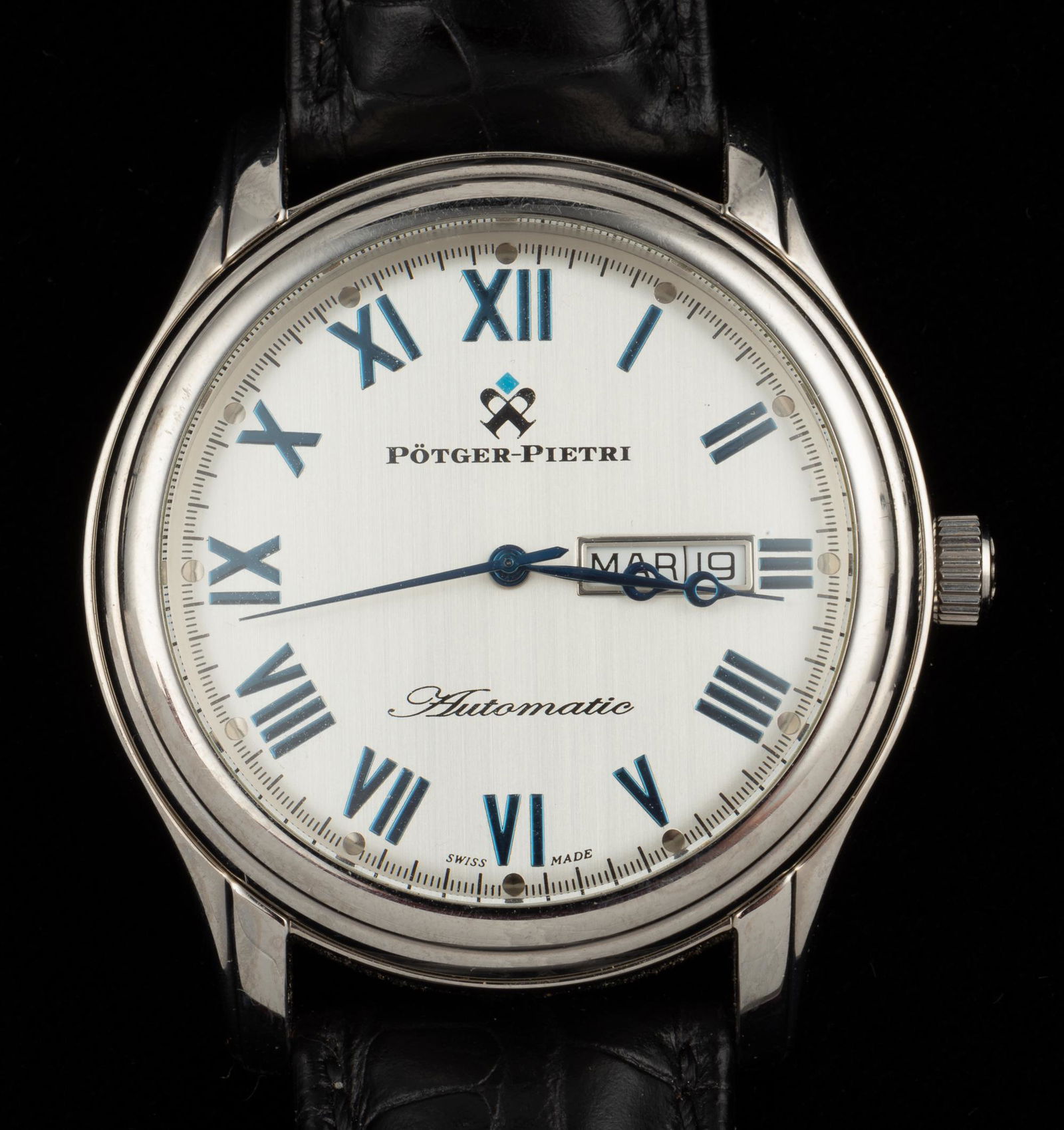 Potger-Pietri PP012 Wristwatch: With calendar. Stainless steel case on black leather band. 1-7/8" lug to lug. Runs. IMPORTANT: Before bidding, please read the terms and conditions. When you registered for the auction you agreed to t