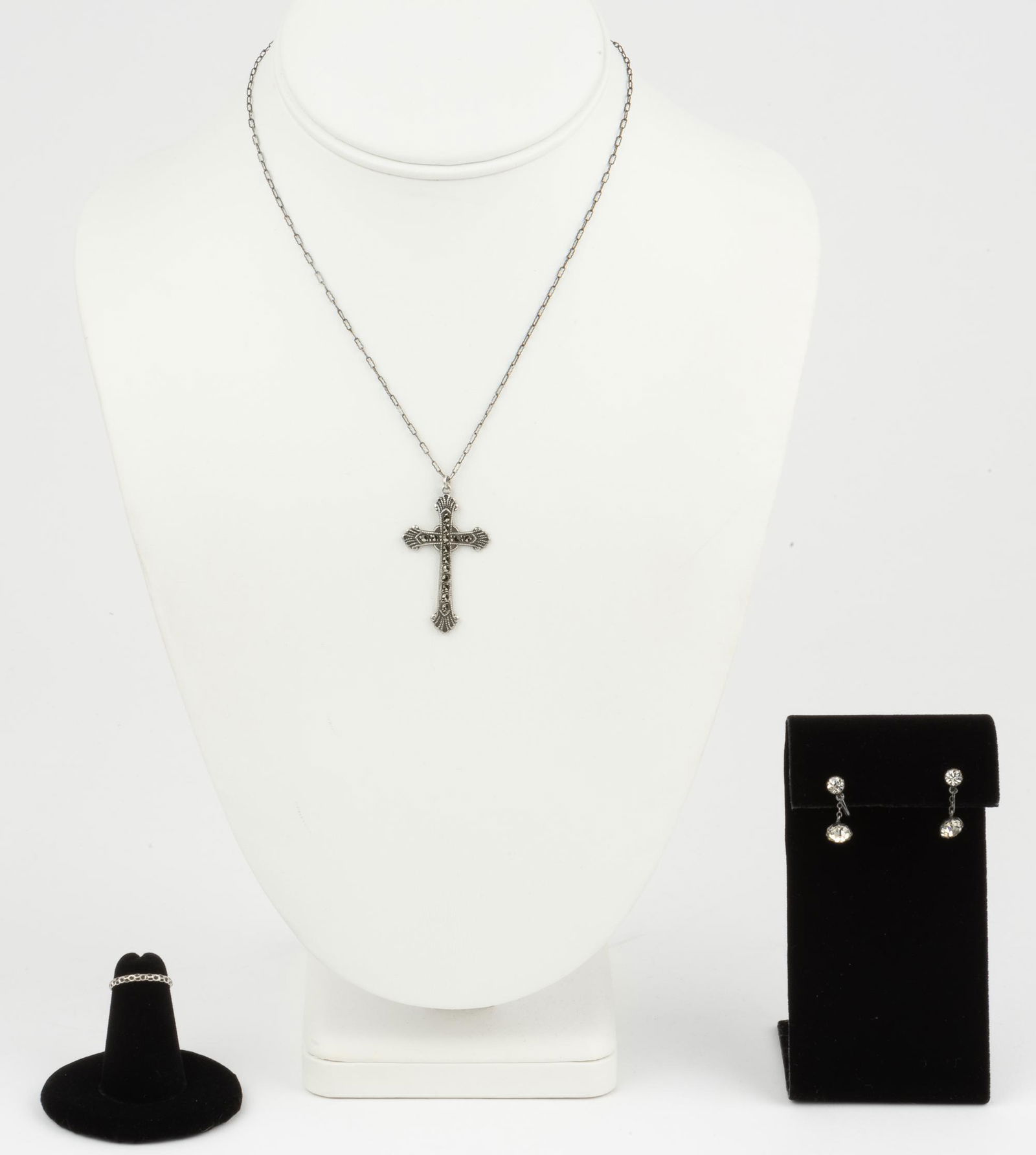 Silver Necklace, Ring, and Earrings: Cross pendant with marcasites. Inscribed Gertrude Wright. St. P.C.C. 37. 1 1/2" long on 15" chain. Ring size 2.5. Screwback earrings 3/4" long. IMPORTANT: Before bidding, please read the terms and con