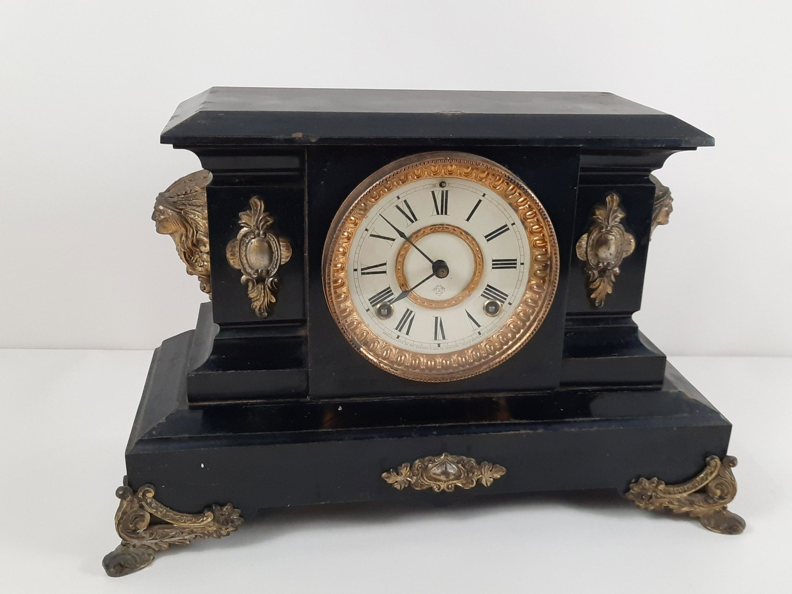 Ansonia Mantel Clock: Starts and stops. 16-1/2" wide x 6-3/4" deep x 10-1/2" high. Some losses to case. IMPORTANT: Before bidding, please read the terms and conditions. When you registered for the auction you agreed to the