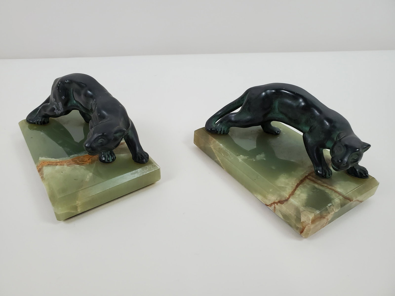 Pair Of Panther Bookends: 6" wide X 3 1/2" deep X 3" high. IMPORTANT: Before bidding, please read the terms and conditions. When you registered for the auction you agreed to these terms and will be required to comply with them