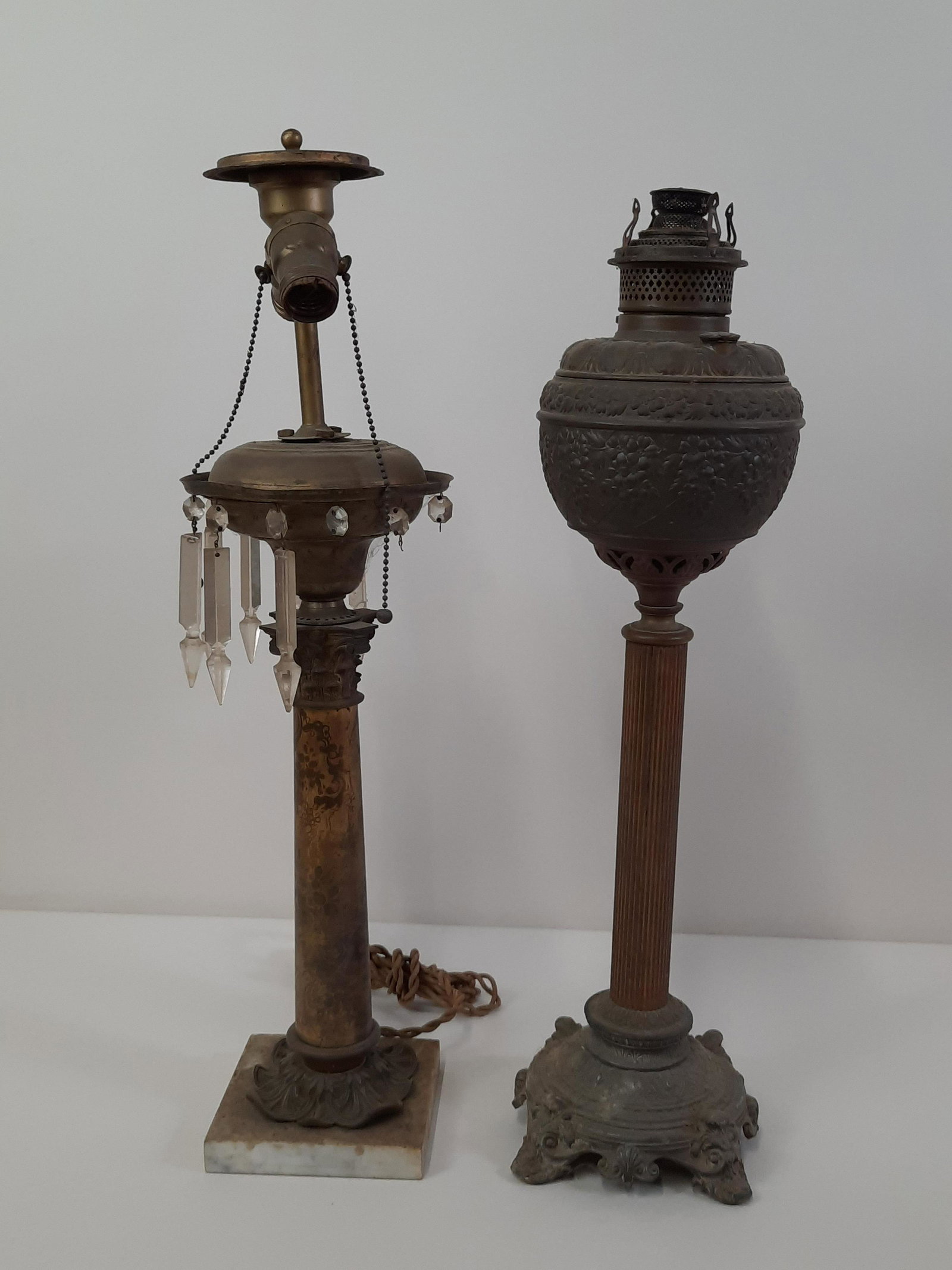 2 Antique Lamps: 24" to 25" high. One electrified and one oil. Sold as is. IMPORTANT: Before bidding, please read the terms and conditions. When you registered for the auction you agreed to these terms and will be req