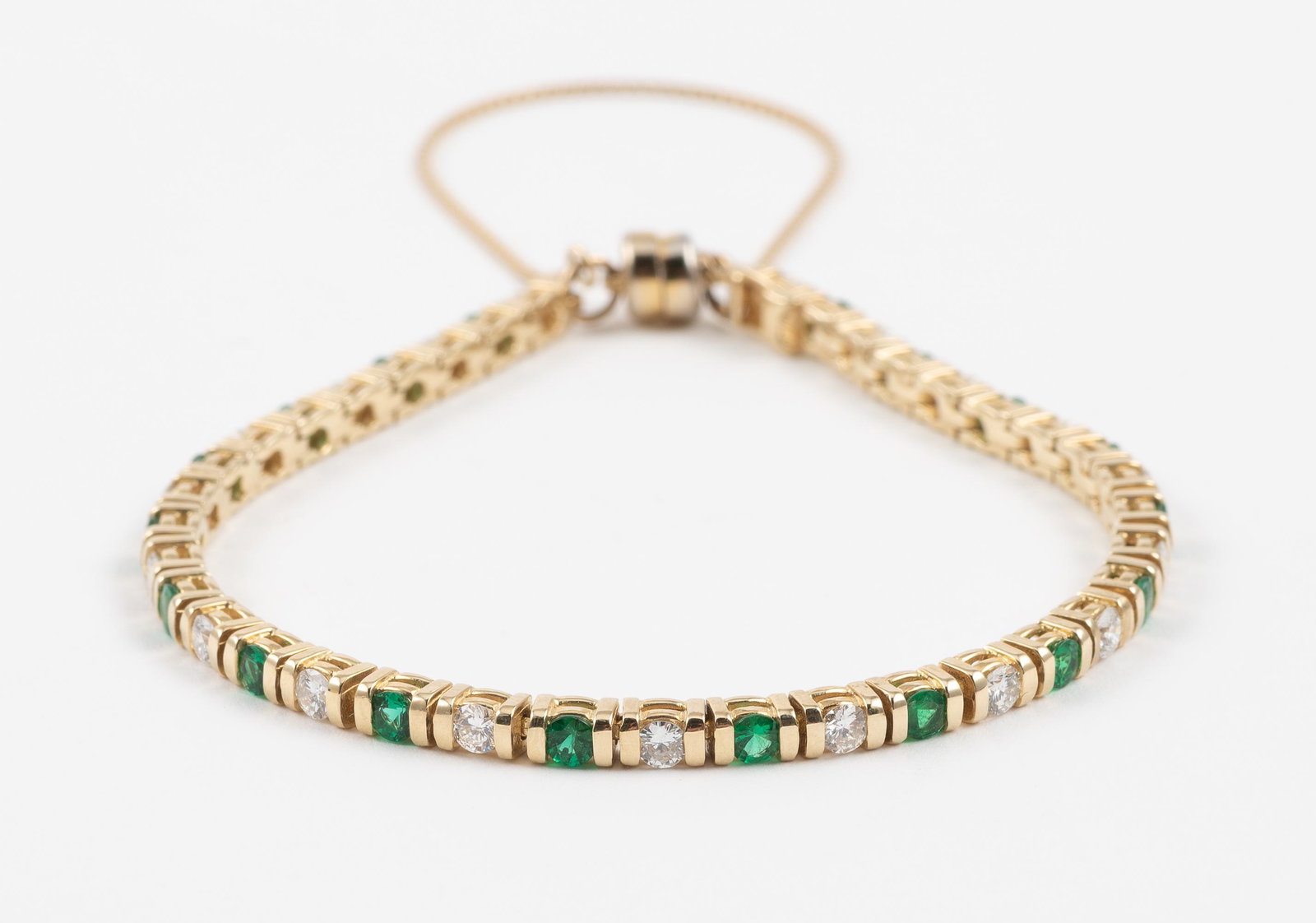 14K Emerald & 1.9 CTW Diamond Bracelet: DESCRIPTION: Tested 14k bracelet set with nineteen approximately .09 carat each round faceted emeralds and nineteen .10 carat each round brilliant cut diamonds (Clarity SI2, Color G-H). MEASUREMENTS: 