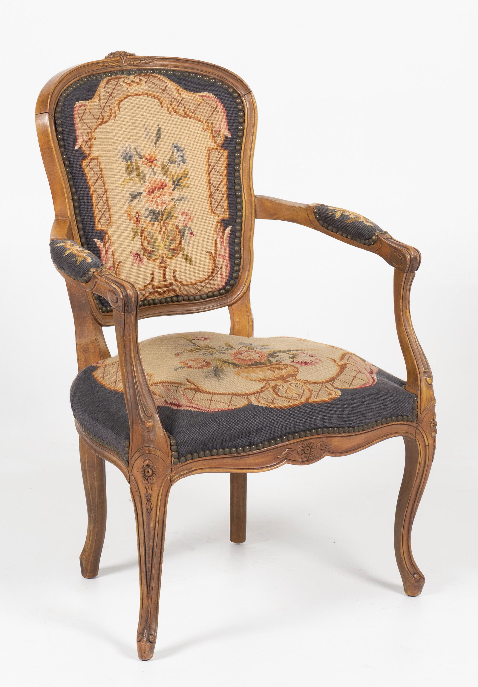 French Louis XV Fauteuil Armchair: DESCRIPTION: French Louis XV fauteuil armchair. Mixed fruitwoods. Circa 19th century. Carved Rococo back with a curvaceous over-stuffed seat resting on 4 Rococo curved legs. MEASUREMENTS: 23 " wide x 