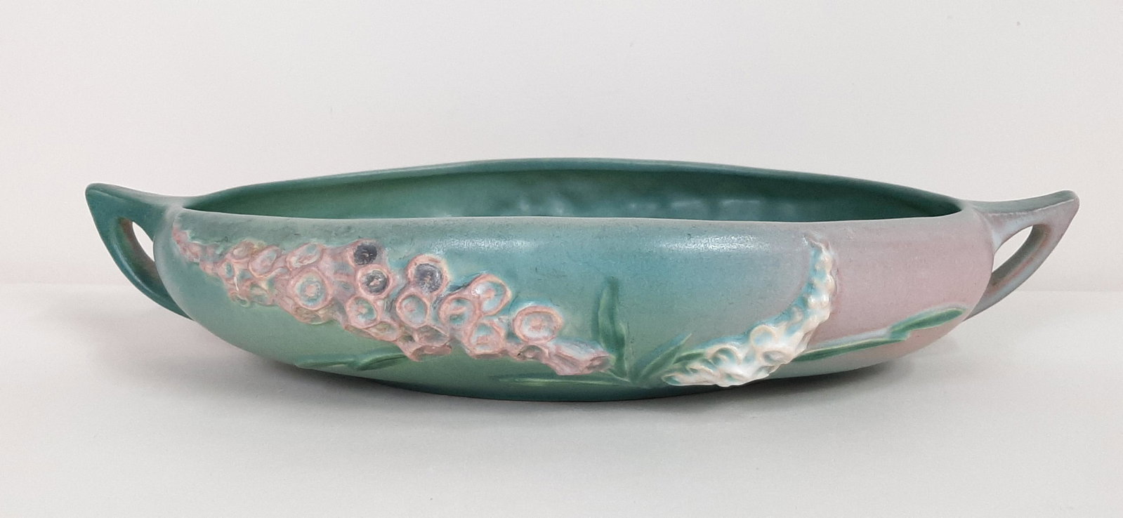 10" Roseville Foxglove Bowl: 14-1/4" wide X 8-3/4" deep X 2-1/2" high. Pattern 421-10 IMPORTANT: Before bidding, please read the terms and conditions. When you registered for the auction you agreed to these terms and will be requ