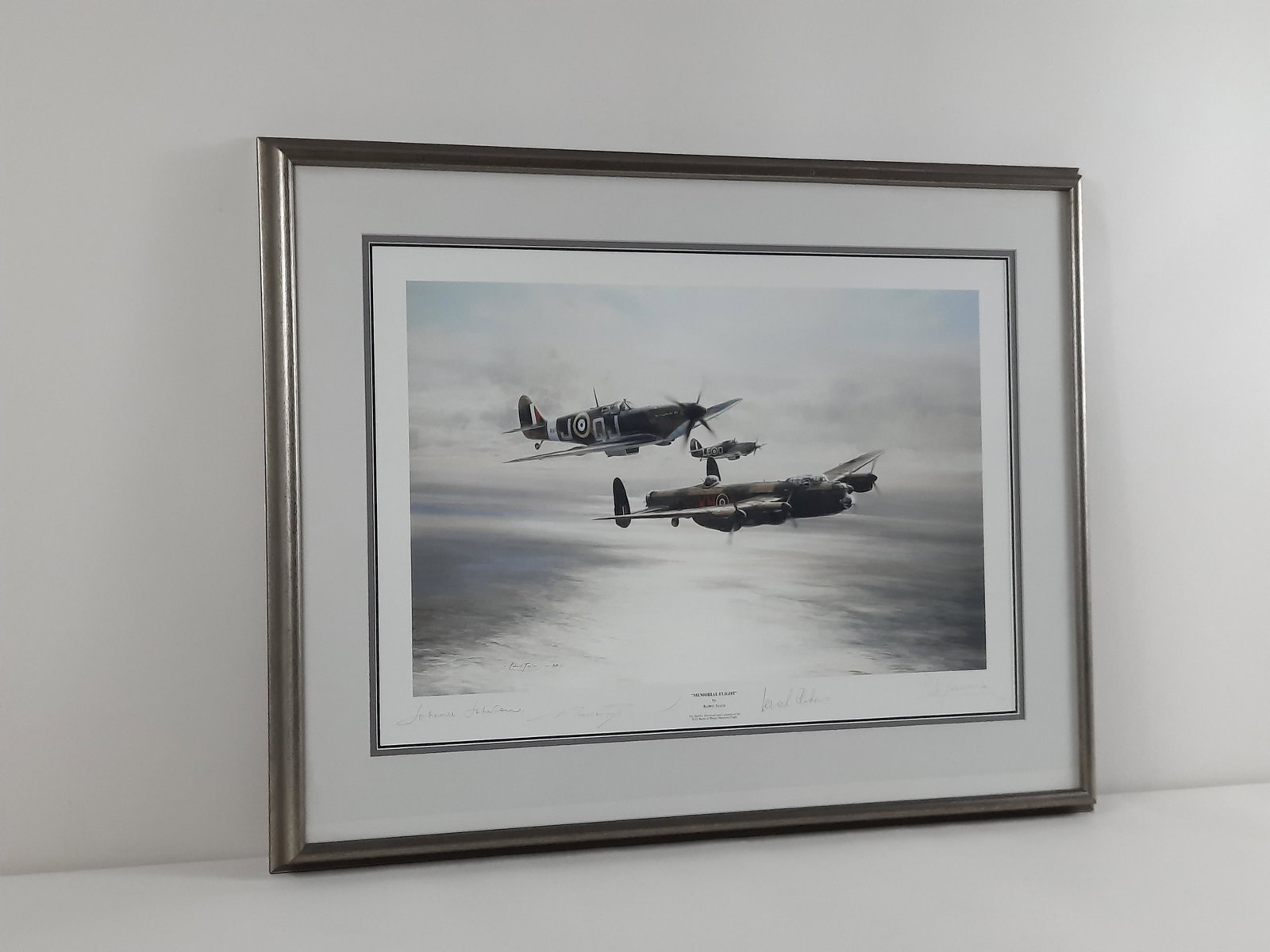 Robert Taylor "Memorial Flight" Print: Autographed. Overall with frame 24-1/2" high x 31-1/2" wide. IMPORTANT: Before bidding, please read the terms and conditions. When you registered for the auction you agreed to these terms and will be 