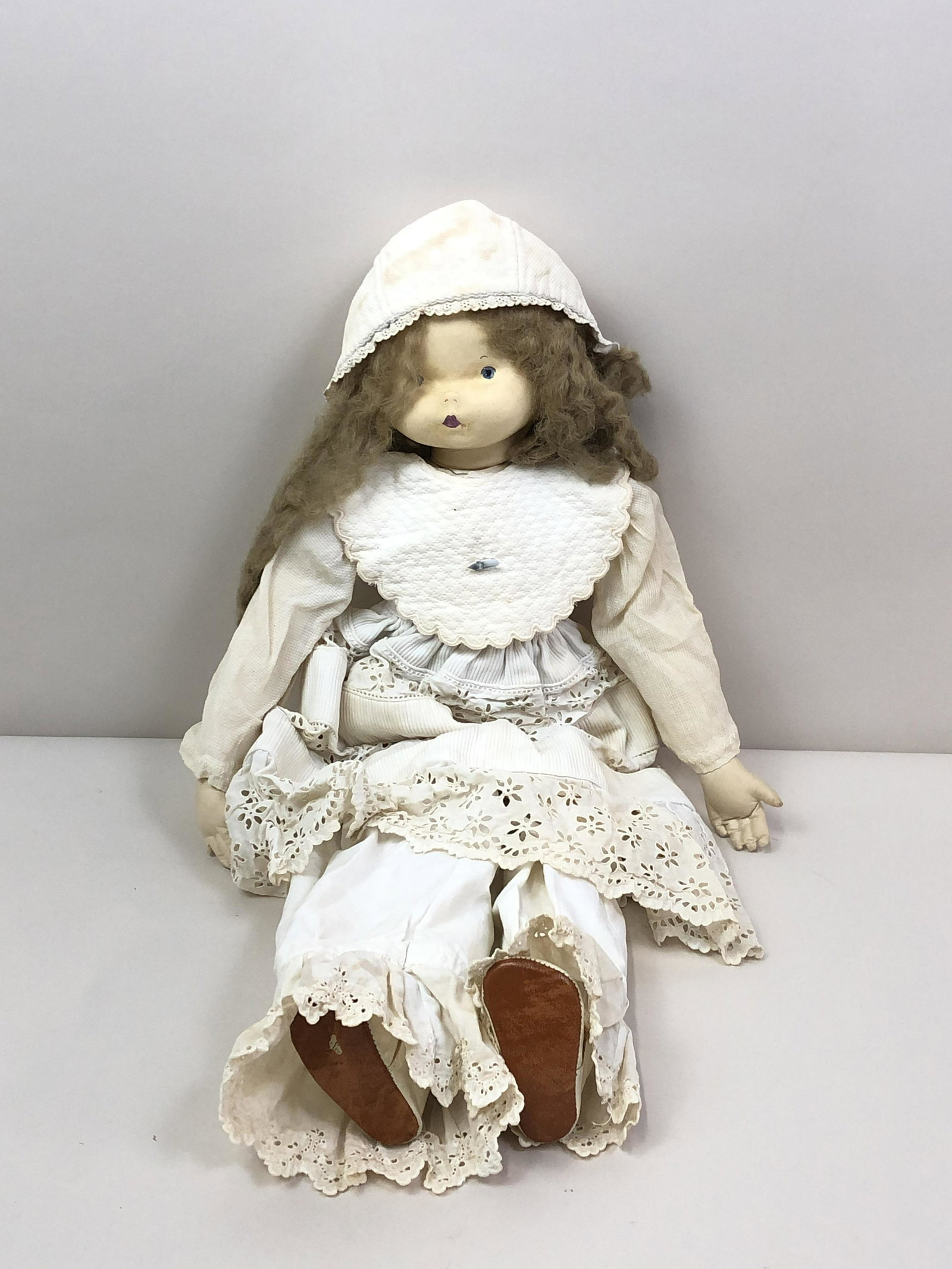 Vintage Doll: Plush body. Face stapled on. 18" long. IMPORTANT: Before bidding, please read the terms and conditions. When you registered for the auction you agreed to these terms and will be required to comply wit