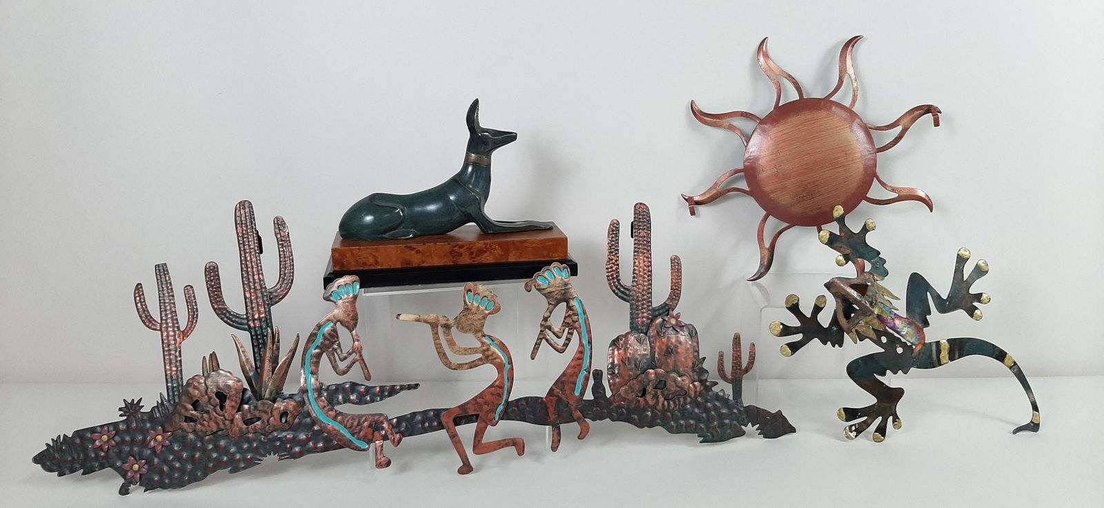 4 Southwestern Sculptures incl Wall Hangings: 11" to 34" wide X 7-1/2" to 13" high. IMPORTANT: Before bidding, please read the terms and conditions. When you registered for the auction you agreed to these terms and will be required to comply with