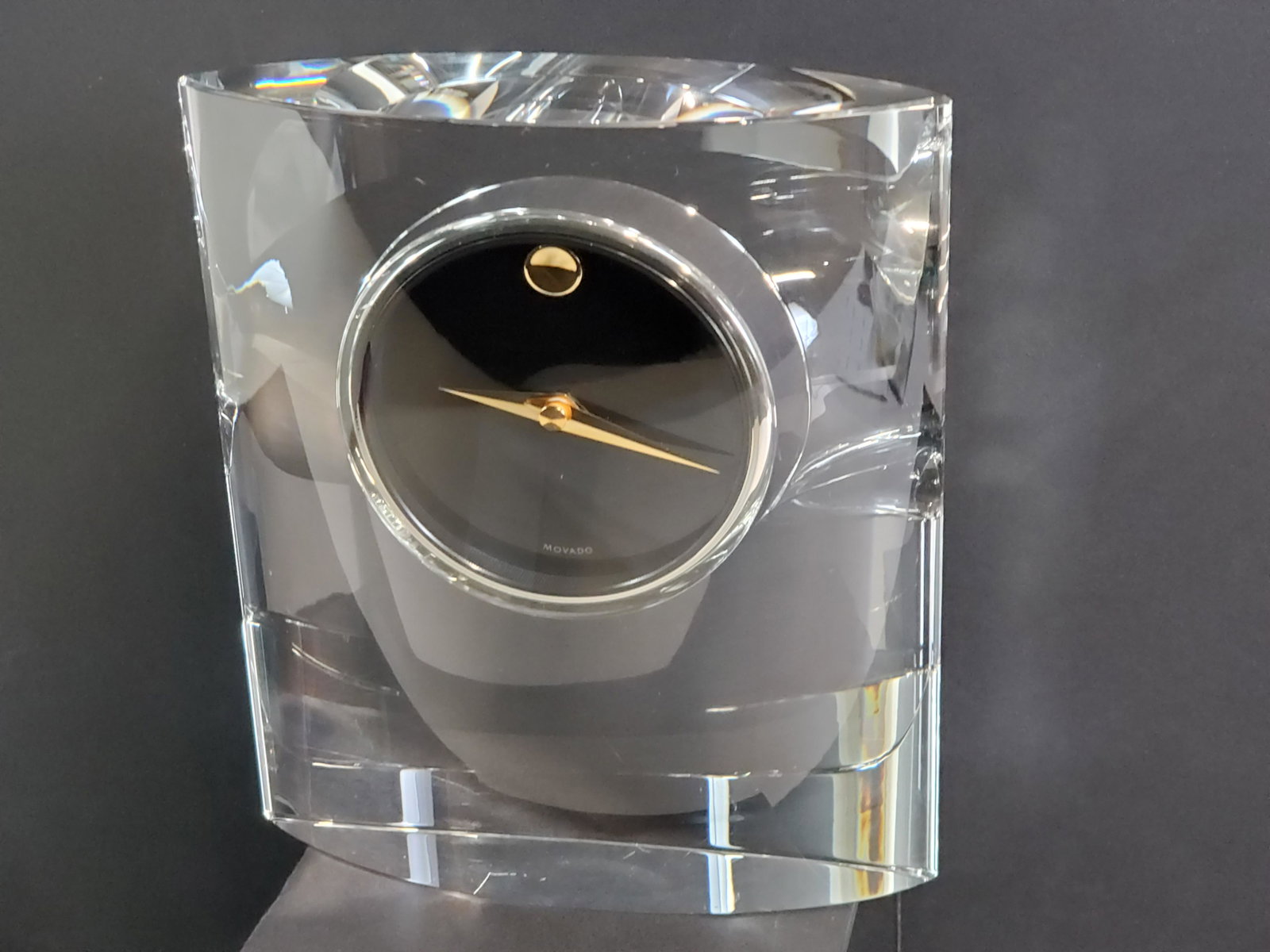 Mavado Glass Desk Clock: Battery operated. Working. 6" wide X 2" deep X 7" high. IMPORTANT: Before bidding, please read the terms and conditions. When you registered for the auction you agreed to these terms and will be requi