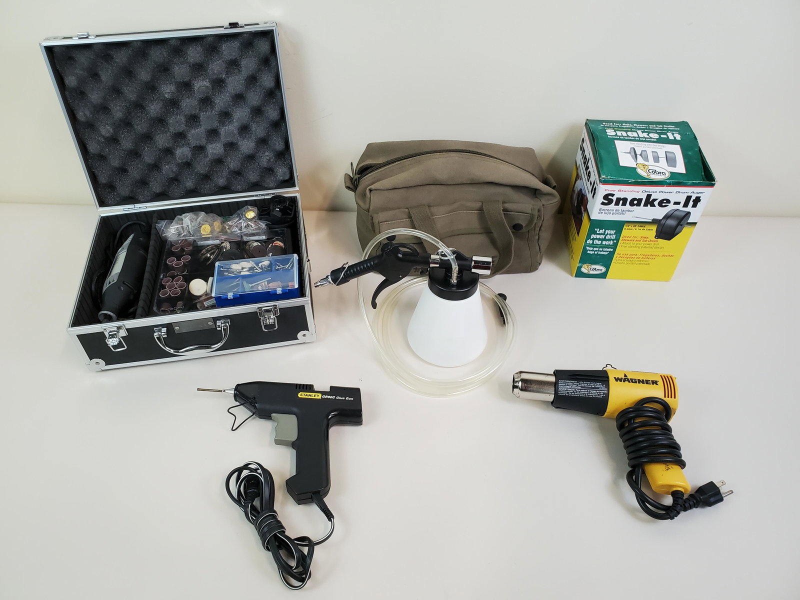 5 Tools Incl Dremel Kit & Paint Gun: Dremel 3000 in hard case with extra bits. Paint gun with bag. Stanley GR90C glue gun. Wagner heat gun. Snale-it. IMPORTANT: Before bidding, please read the terms and conditions. When you registered fo