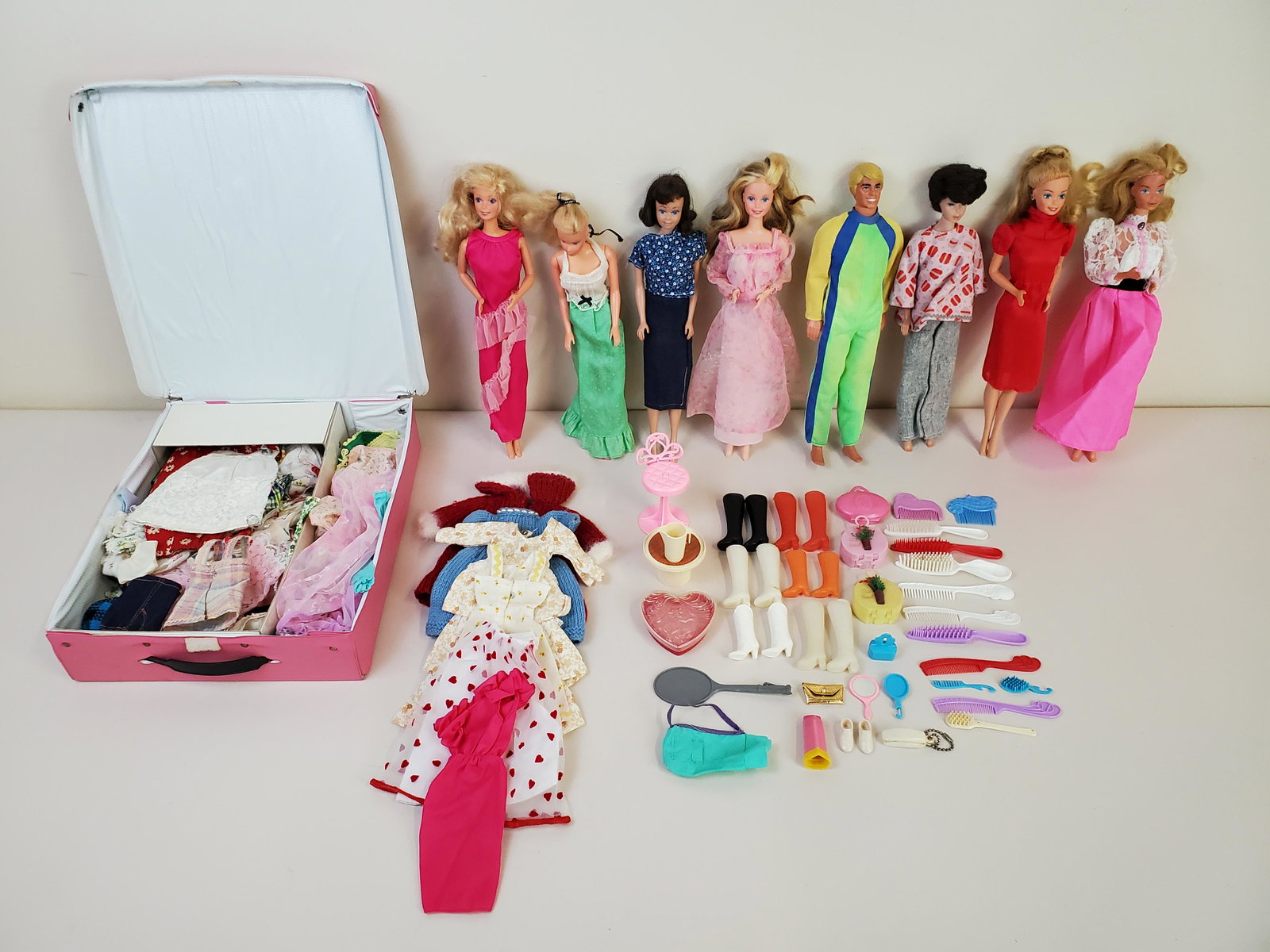 8 Barbies With Accessories: Includes 1958 Skipper, 1968 Hong Kong Ken, 1967 Barbie, 1968 Midget. IMPORTANT: Before bidding, please read the terms and conditions. When you registered for the auction you agreed to these terms and 