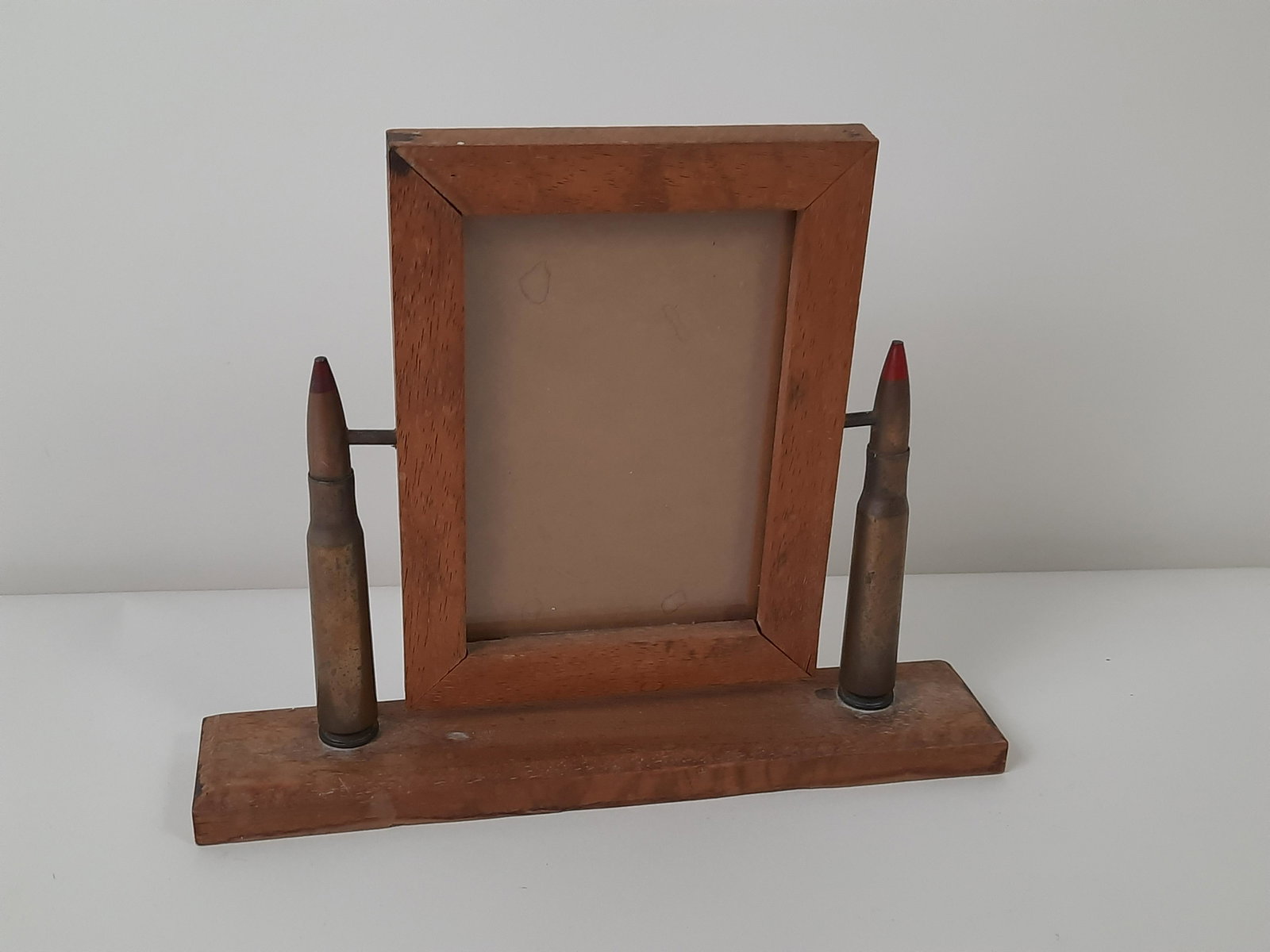 Trench Art Picture Frame: Overall 11" wide x 8-3/4" high. Frame opening: 4" wide x 6" high. IMPORTANT: Before bidding, please read the terms and conditions. When you registered for the auction you agreed to these terms and wil