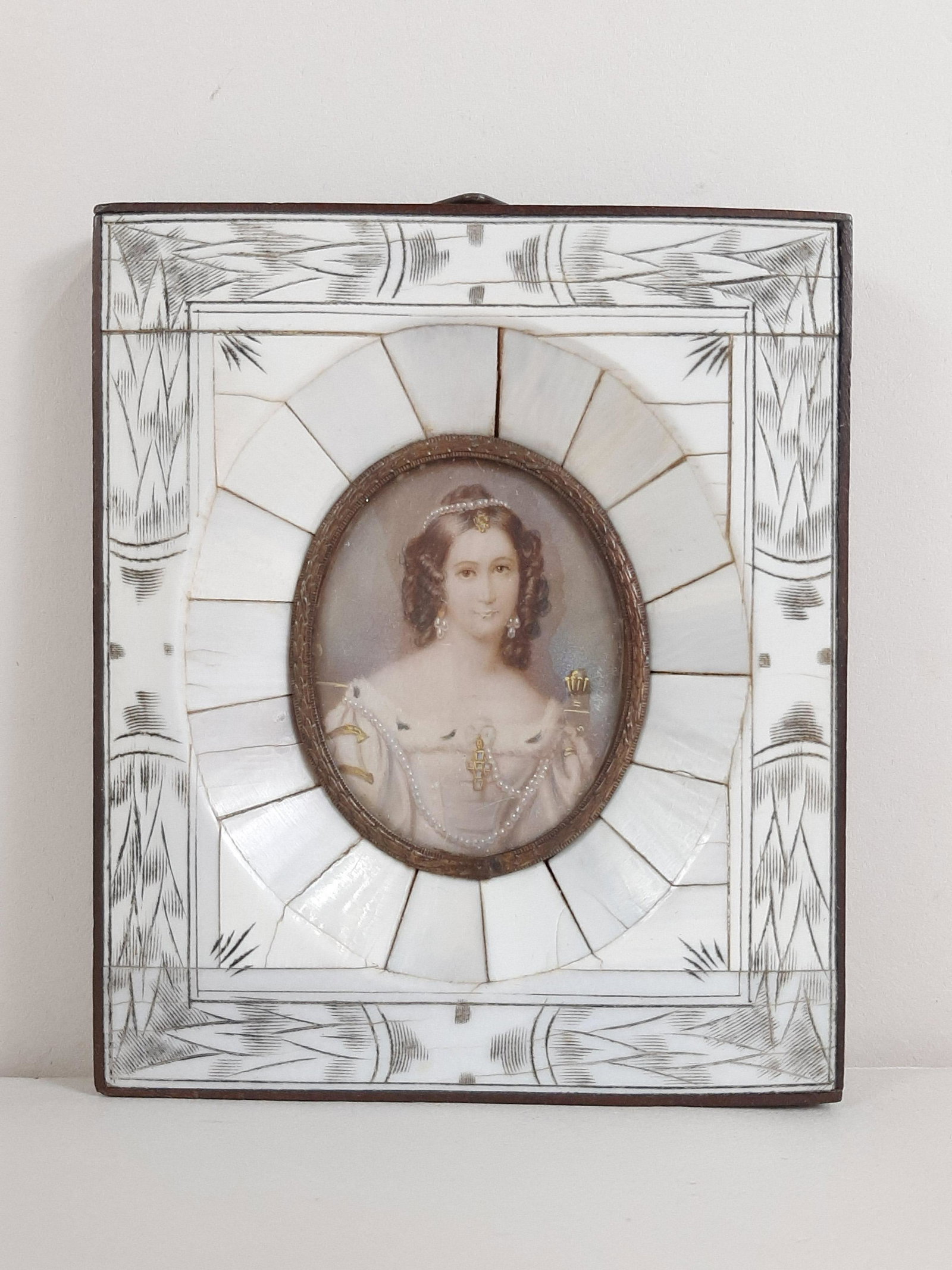 Antique Miniature Portrait in Bone Carved Frame: 3-1/4" wide X 4" high. IMPORTANT: Before bidding, please read the terms and conditions. When you registered for the auction you agreed to these terms and will be required to comply with them.