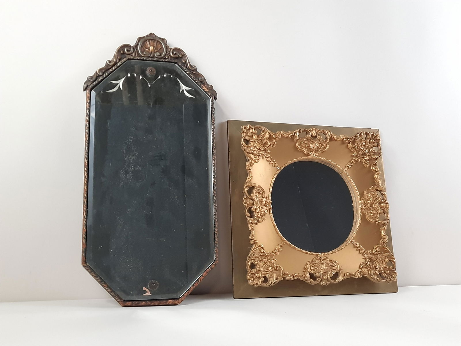 2 Antique Mirrors: Overall with frames 16" to 23-1/4" high x 10-3/4" to 16" wide. Some spotting and streaking to taller mirror. IMPORTANT: Before bidding, please read the terms and conditions. When you registered for th