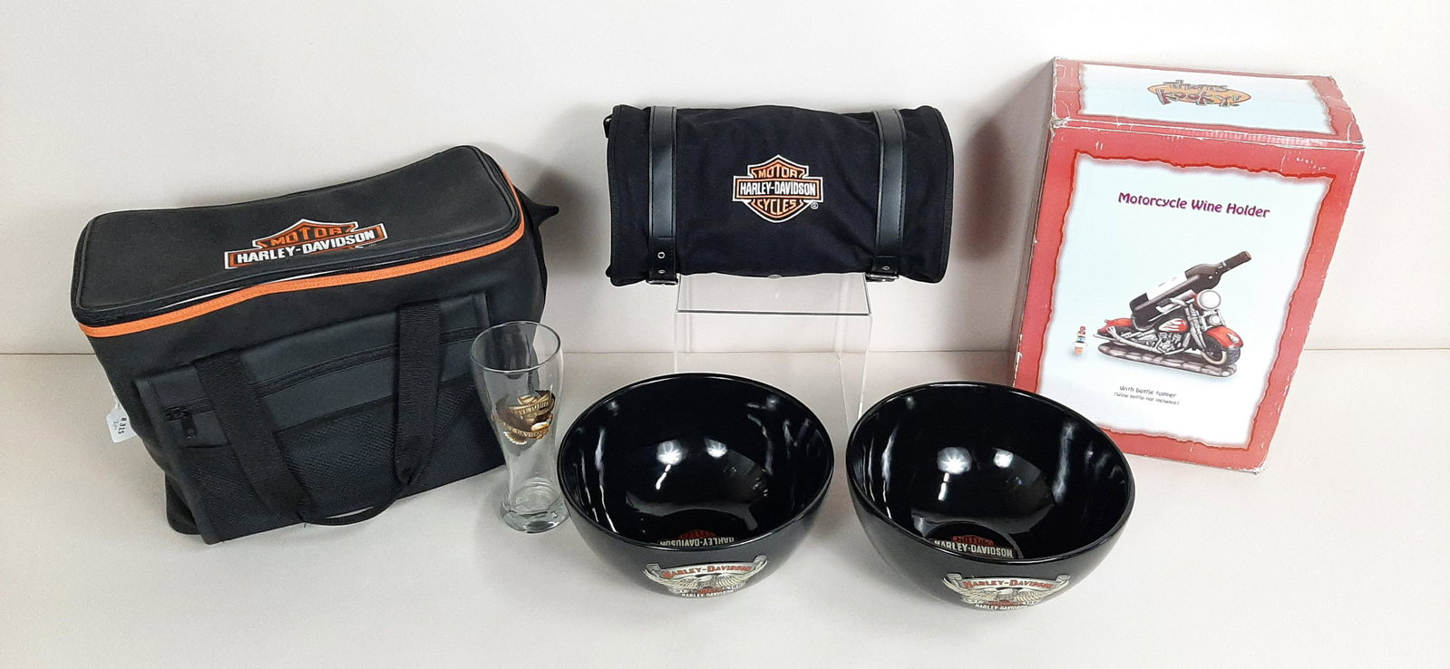 6 Pcs incl. Harley-Davidson Bag and Soft Cooler: Also includes bowls, glass, and motorcycle wine holder. Bowls: 10-1/2" diameter X 5-1/4" high. Glass: 8-1/2" high." Cooler: 16-1/2" wide X 11-1/2" high. IMPORTANT: Before bidding, please read the term