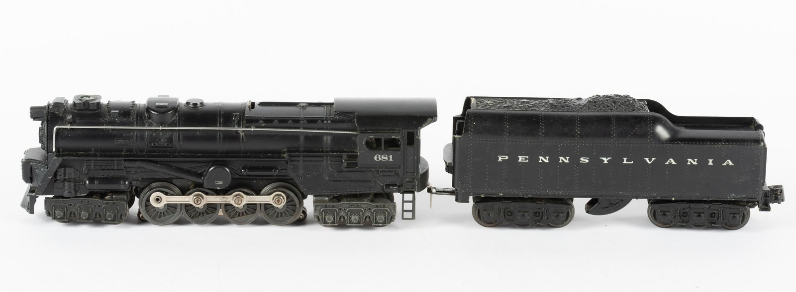Lionel 681 Loco with 2046W Tender: Lionel 681 Pennsylvania Railroad locomotive with 2046W tender. Wear and corrosion both cars. Loss to enamel on tender. IMPORTANT: Before bidding, please read the terms and conditions. When you registe