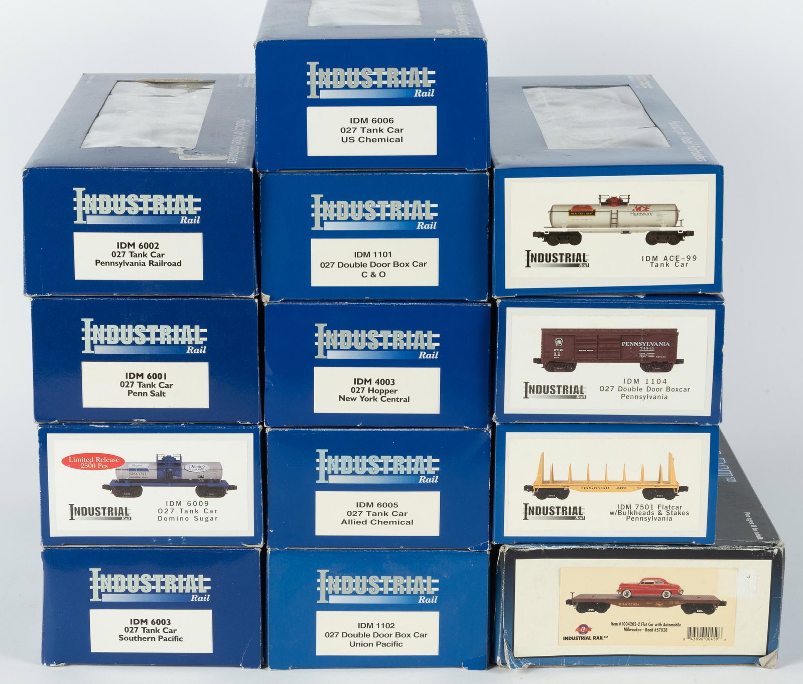 13 Industrial Rail Cars: Includes seven tank cars, three box cars, hopper car, and two flat cars. All used in original boxes. Boxes with shelf wear and creasing. IMPORTANT: Before bidding, please read the terms and conditions