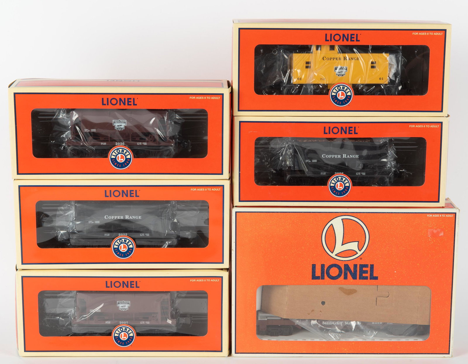 6 Lionel Ore Cars: Includes 4 copper range ore cars: 6-16486, 6-16484, 6-16485, and 6-16488, copper range caboose 6-36541, and midget mines ore dump car 6-16749. All unused in original boxes. Boxes with shelf wear. IMPO