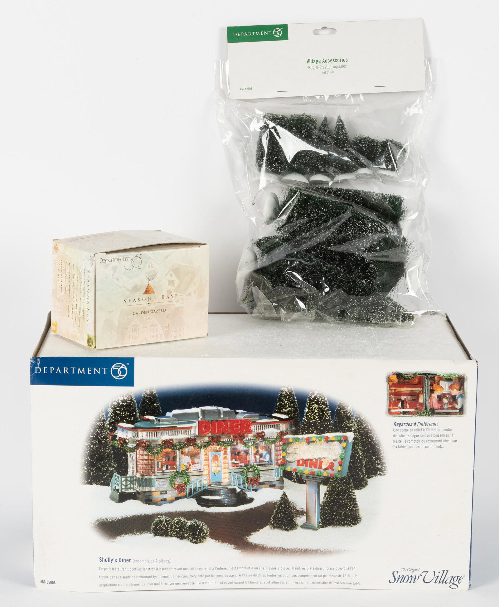 3 Department 56 Christmas Accessories: Includes Shelly's Diner from Snow Village collection, Garden Gazebo from Seasons Bay collection, and Bag-O-Frosted Topiaries. All in original boxes/plastic. Gazebo box with tear to side. IMPORTANT: Be