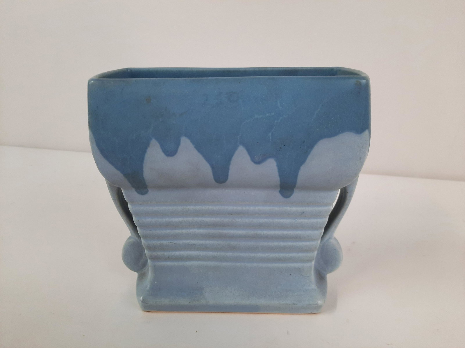 6-1/4" Roseville Carnelian Vase: 6-3/4" wide x 2-1/2" deep x 6-1/4" high. Minor chips under base. IMPORTANT: Before bidding, please read the terms and conditions. When you registered for the auction you agreed to these terms and will