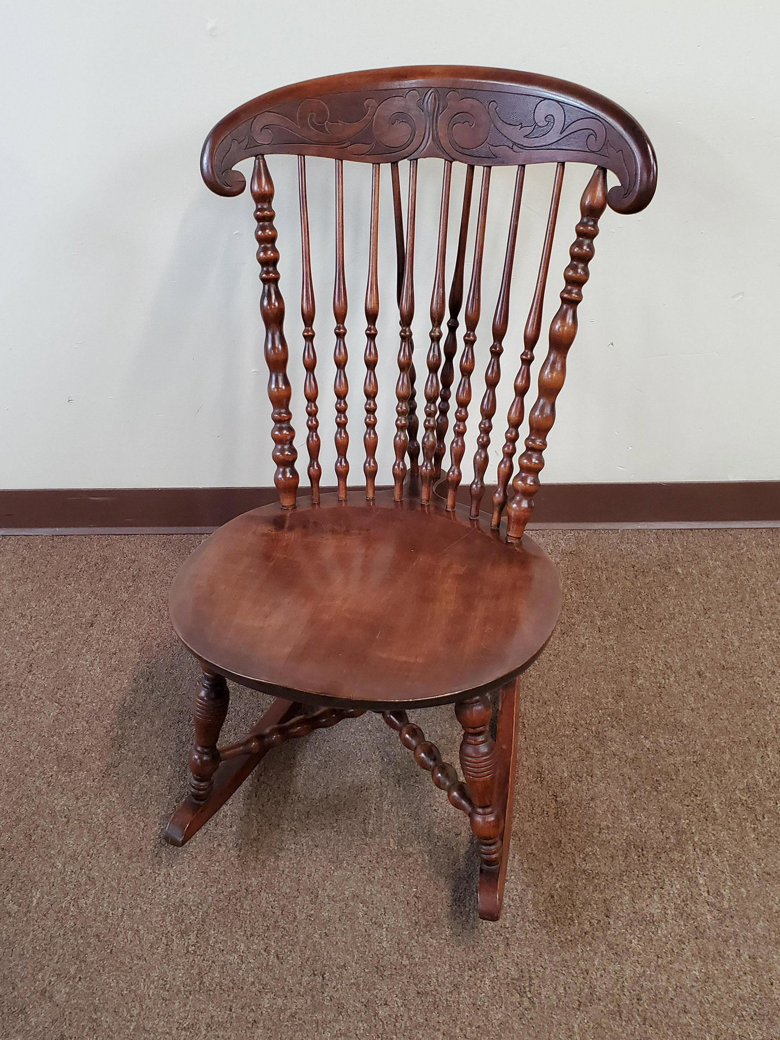 Carved Back Rocker: 19" wide X 28 1/2" deep X 33 1/2" high. Slight crack in seat front. IMPORTANT: Before bidding, please read the terms and conditions. When you registered for the auction you agreed to these terms and w