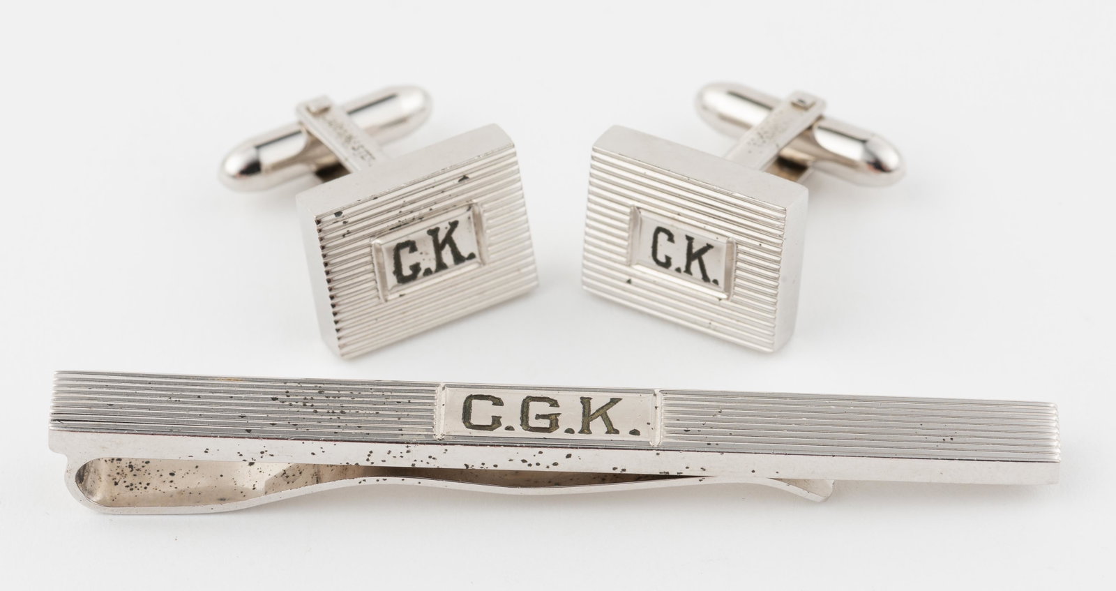 Lamode Sterling Cuff Links and Tie Bar: Cuff links monogrammed CK. Tie bar monogrammed CGK. Cuff links 1/2" x 2/3". Money clip 2 3/4". IMPORTANT: Before bidding, please read the terms and conditions. When you registered for the auction you 