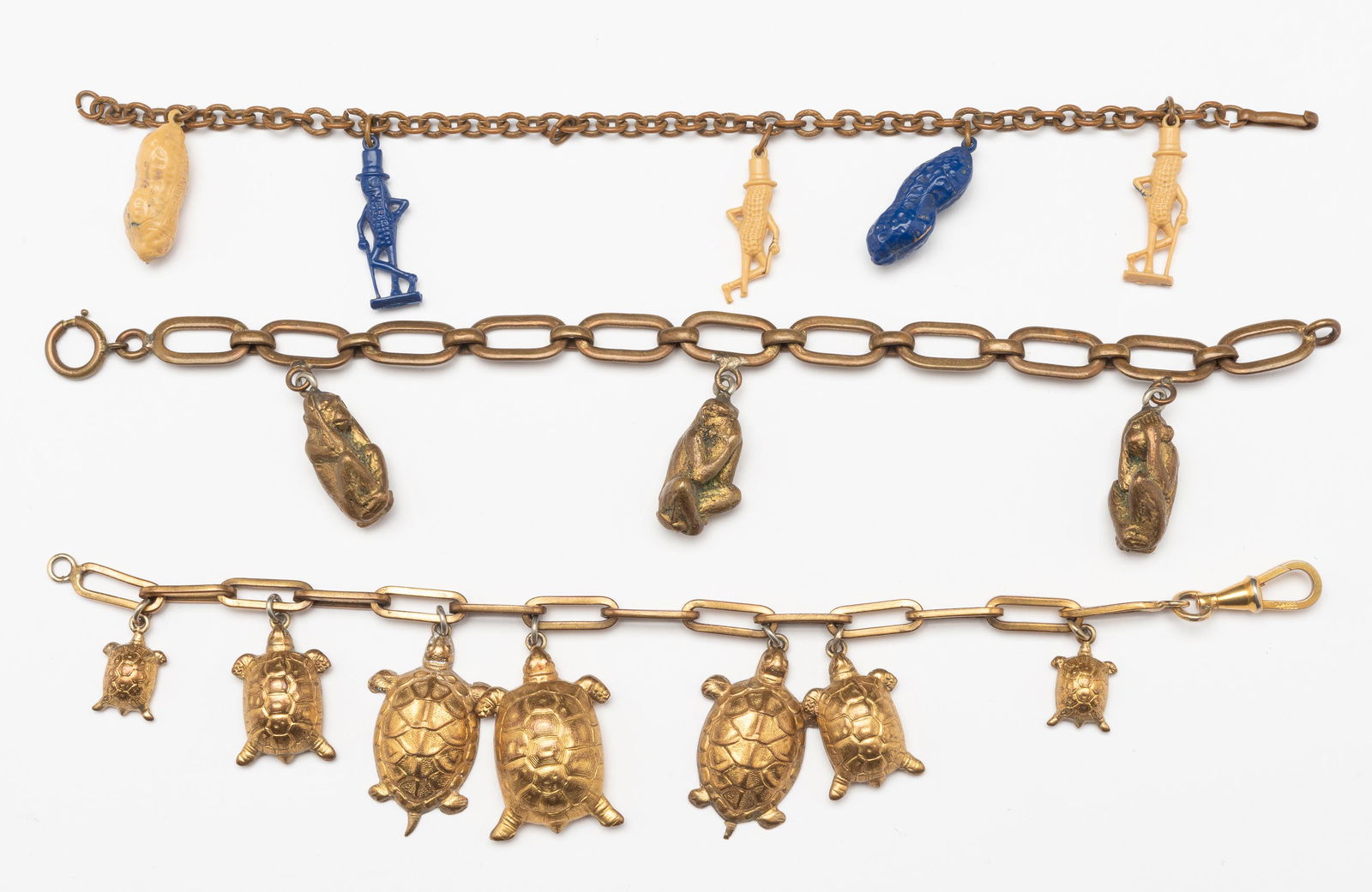 3 Vintage Costume Charm Bracelets Incl Mr. Peanut: Each 7-1/2" long. IMPORTANT: Before bidding, please read the terms and conditions. When you registered for the auction you agreed to these terms and will be required to comply with them.