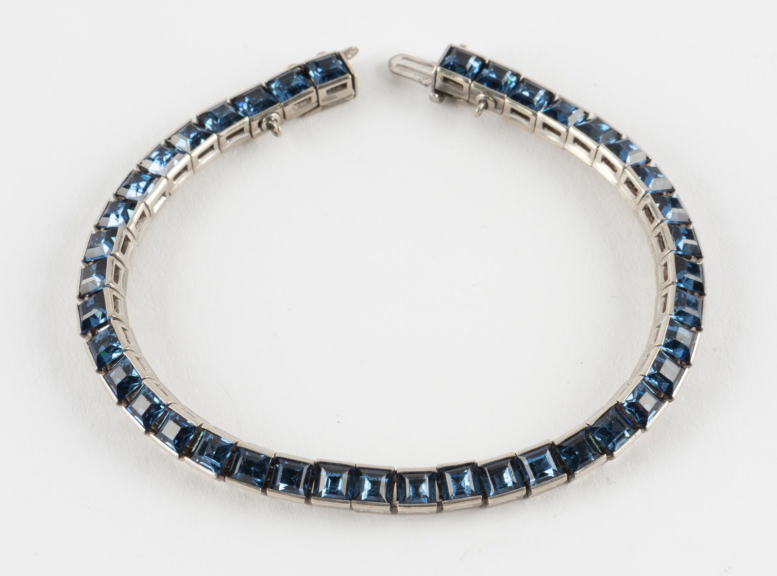 Vintage Trifari Blue Crystal Bracelet: 3/16" wide x 7-3/16" long. IMPORTANT: Before bidding, please read the terms and conditions. When you registered for the auction you agreed to these terms and will be required to comply with them.