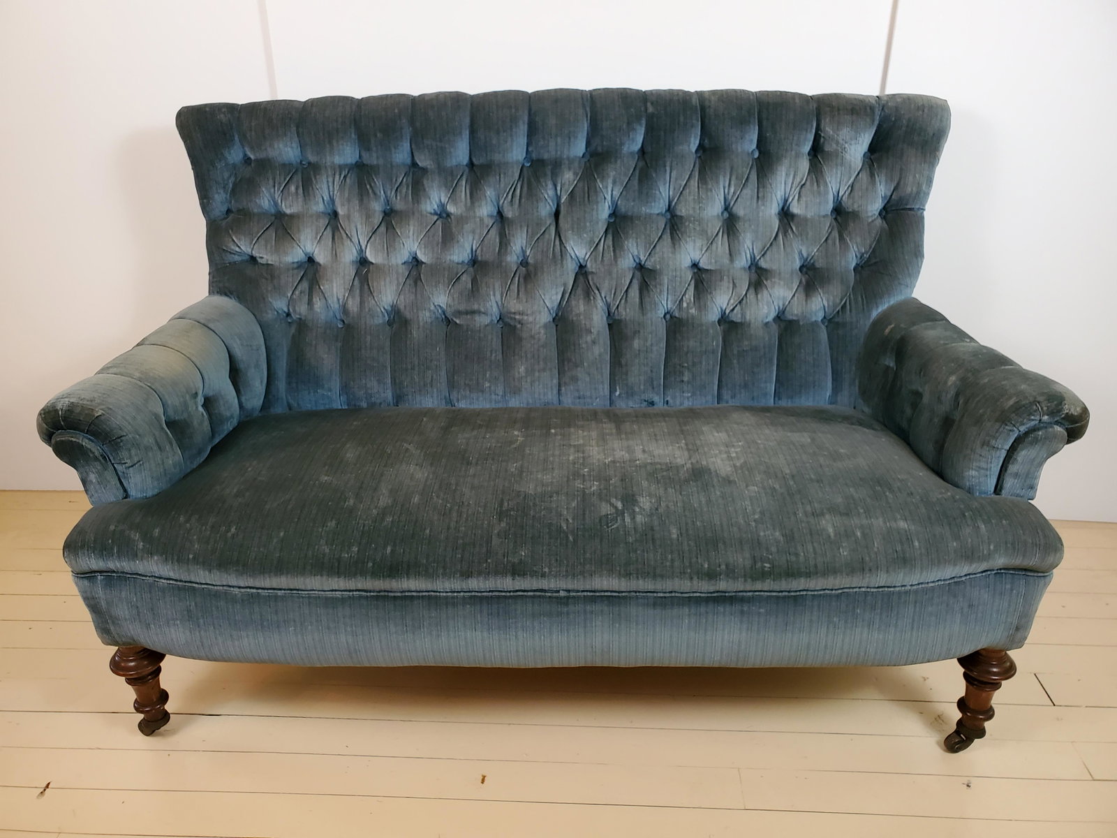 Victorian Blue Sofa: 37 1/4" wide X 24 1/4" deep X 55 1/4" high. Some fading and discoloring. IMPORTANT: Before bidding, please read the terms and conditions. When you registered for the auction you agreed to these terms 
