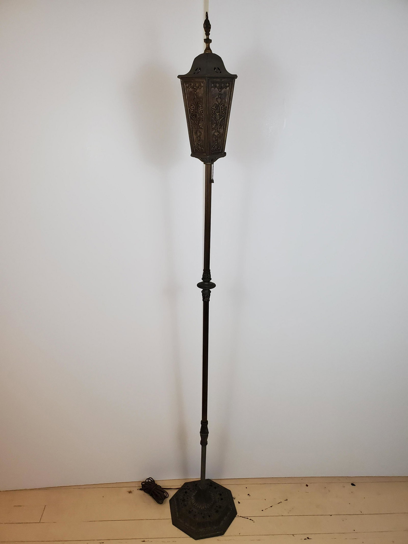 Antique Metal Floor Lamp: 12" diameter X 67 1/2" high. Has damage under light. IMPORTANT: Before bidding, please read the terms and conditions. When you registered for the auction you agreed to these terms and will be required