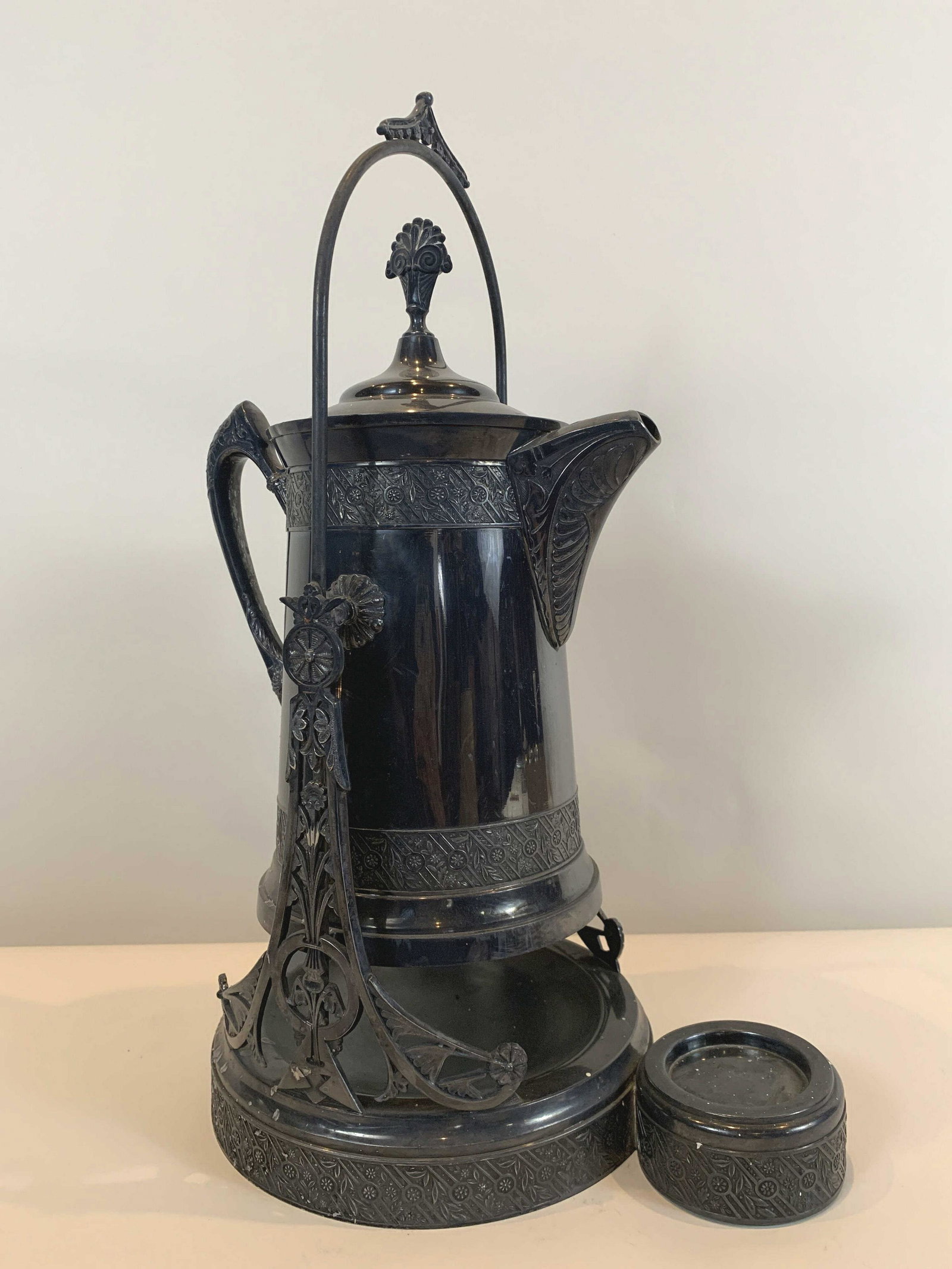 Victorian Silverplate Hot Water: On stand. 20" high, base 9" wide. IMPORTANT: Before bidding, please read the terms and conditions. When you registered for the auction you agreed to these terms and will be required to comply with the