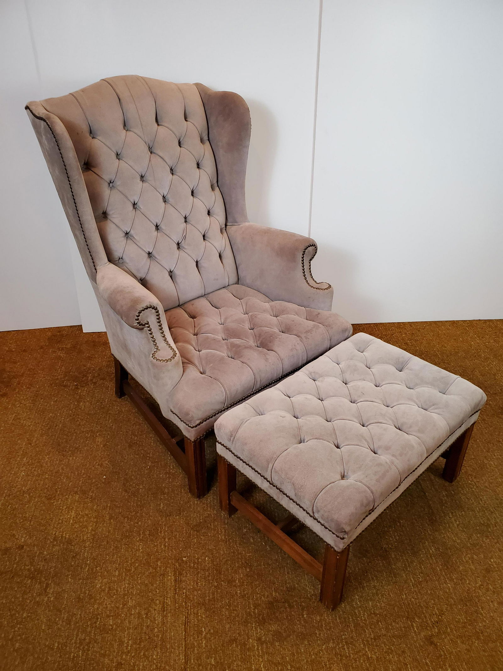 Suede Finish Leather Wingback Chair With Ottoman: Chair 30 1/4 wide X 25 1/4" deep X 43" high. Some stains and discoloring. Ottoman q26" wide X 17 1/2" deep X 15" high. IMPORTANT: Before bidding, please read the terms and conditions. When you registe