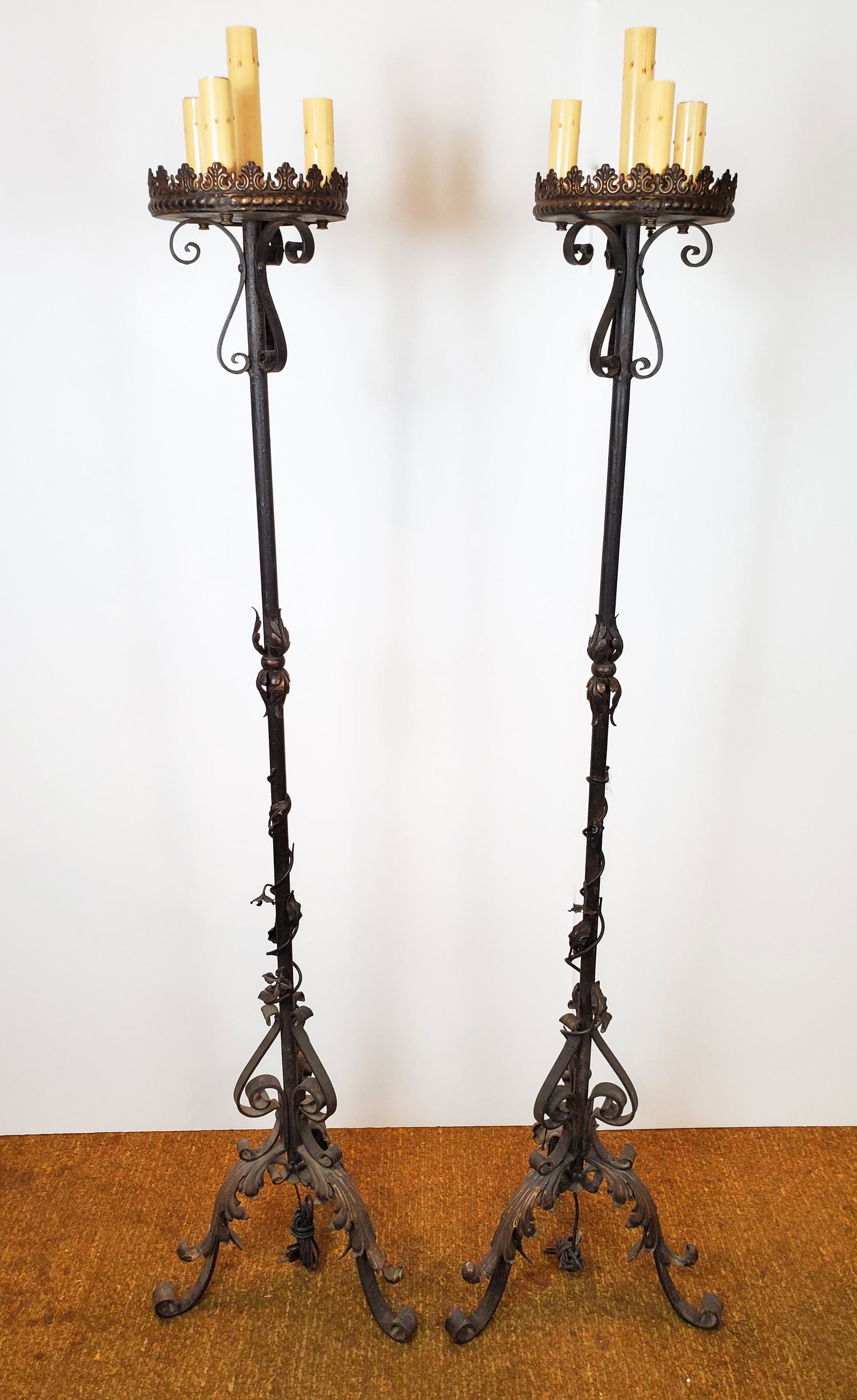 Pair Of Metal Floor Candelabra: 16" wide X 15" deep X 66" high. Electrified. Both have some rust. IMPORTANT: Before bidding, please read the terms and conditions. When you registered for the auction you agreed to these terms and wil