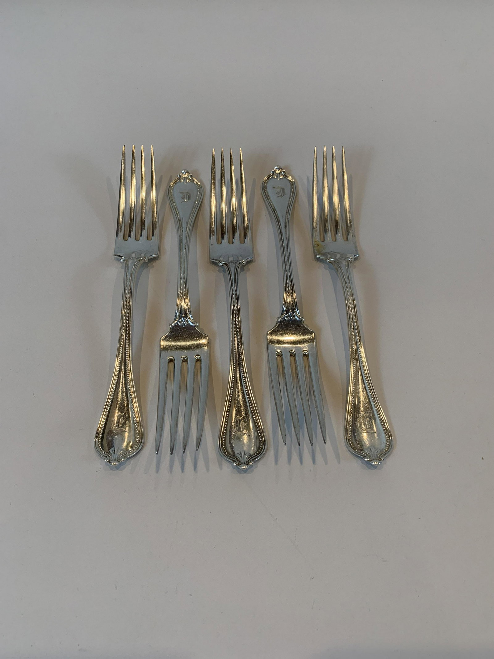 5 Sterling Dinner Forks: 7.8 dwt. IMPORTANT: Before bidding, please read the terms and conditions. When you registered for the auction you agreed to these terms and will be required to comply with them.