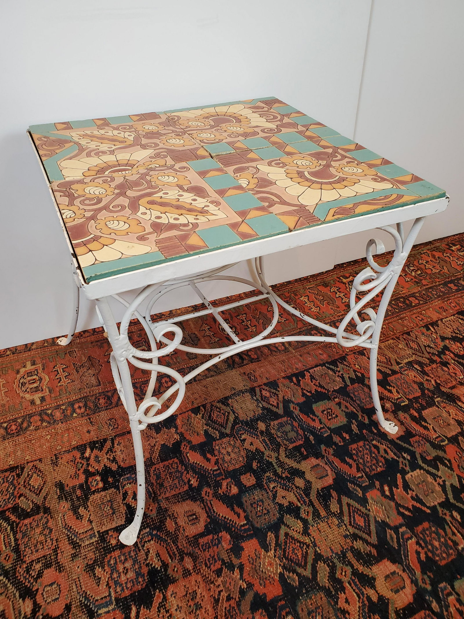 Tile Top Table: Iron base. 23" wide X 23" high X 21" high. IMPORTANT: Before bidding, please read the terms and conditions. When you registered for the auction you agreed to these terms and will be required to comply